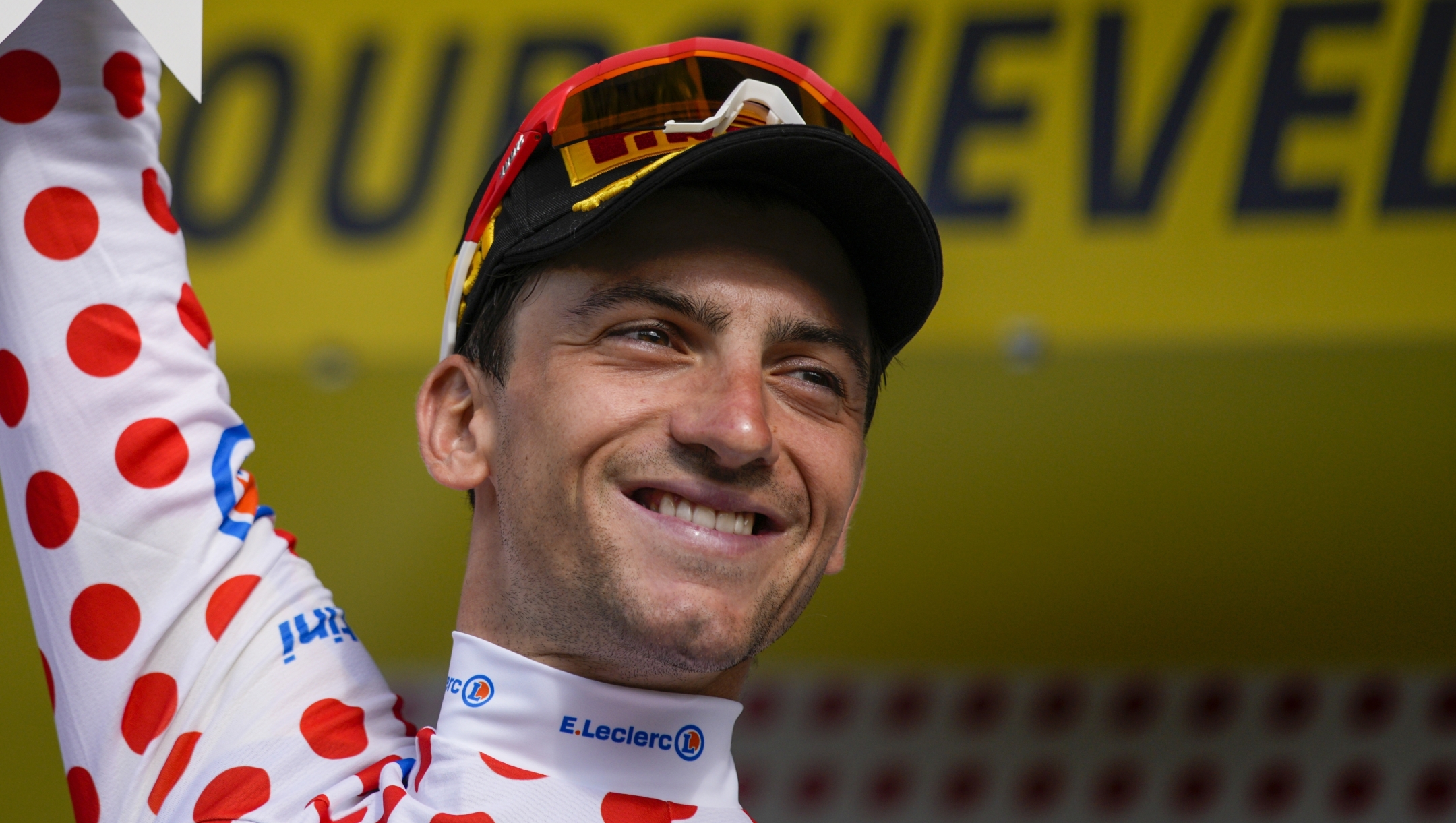 Italy's Giulio Ciccone, wearing the best climber's dotted jersey, celebrates on the podium after the seventeenth stage of the Tour de France cycling race over 166 kilometers (103 miles) with start in Saint-Gervais Mont-Blanc and finish in Courchevel, France, Wednesday, July 19, 2023. (AP Photo/Daniel Cole)
