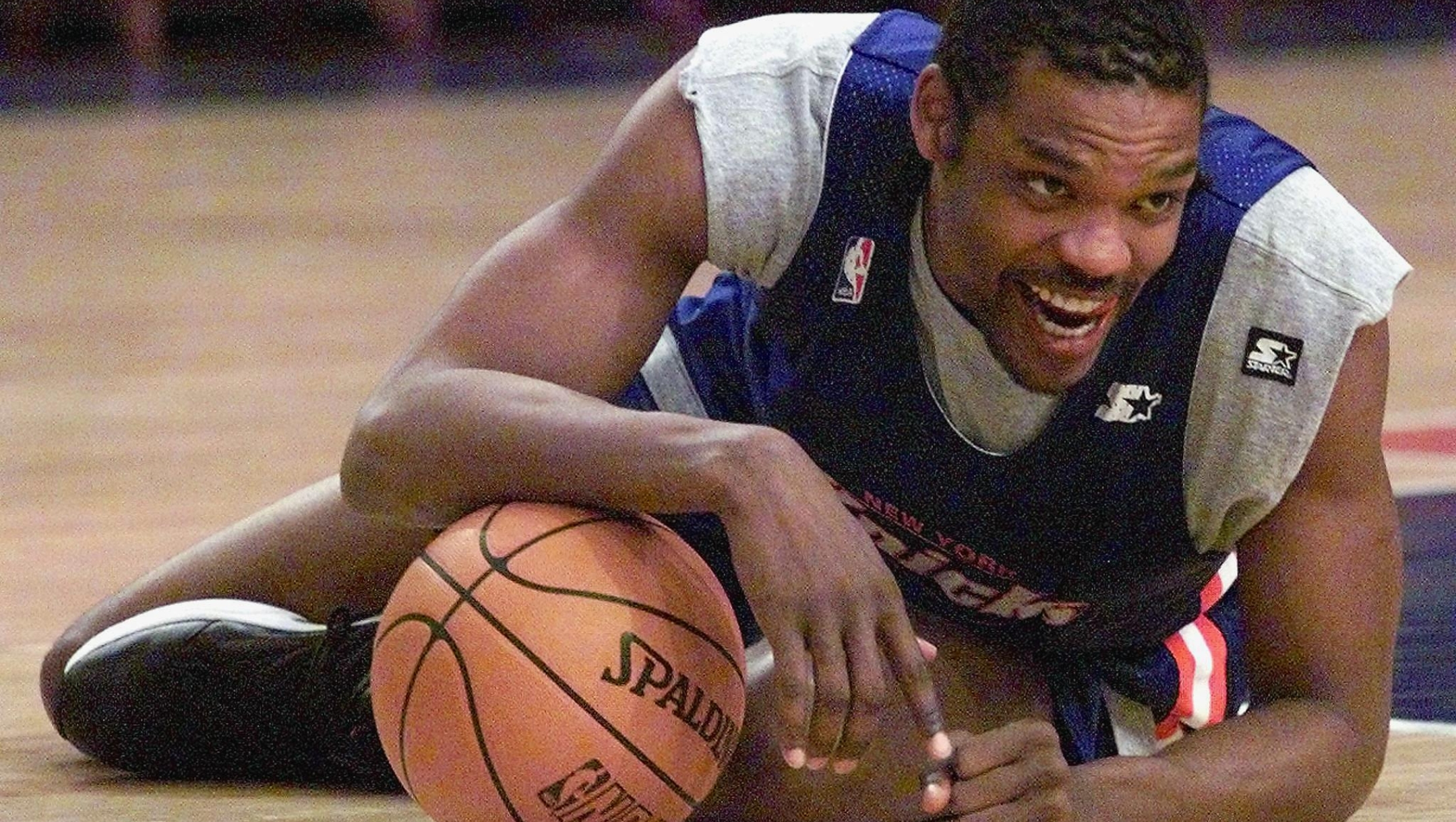 Latrell Sprewell of the New York Knicks laughs with teammates 22 June, 1999, during practice at Madison Square Garden in New York. Sprewell and the Knicks trail the San Antonio Spurs one game to two in the best-of-seven NBA finals. (ELECTRONIC IMAGE) AFP PHOTO/Jeff HAYNES (Photo by JEFF HAYNES / AFP)