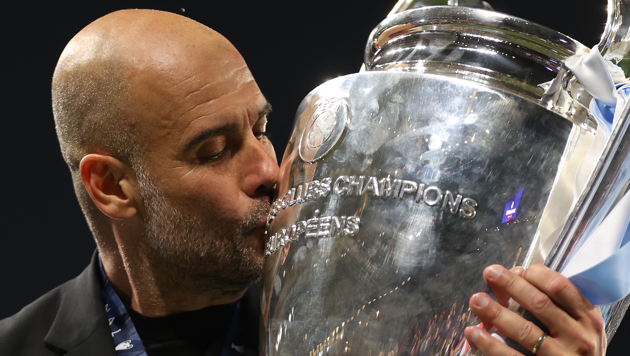 ISTANBUL, TURKEY - JUNE 10:  Pep Guardiola, Manager of Manchester City, kisses the UEFA Champions League trophy after the team's victory during the UEFA Champions League 2022/23 final match between FC Internazionale and Manchester City FC at Atatuerk Olympic Stadium on June 10, 2023 in Istanbul, Turkey. (Photo by Michael Steele/Getty Images)