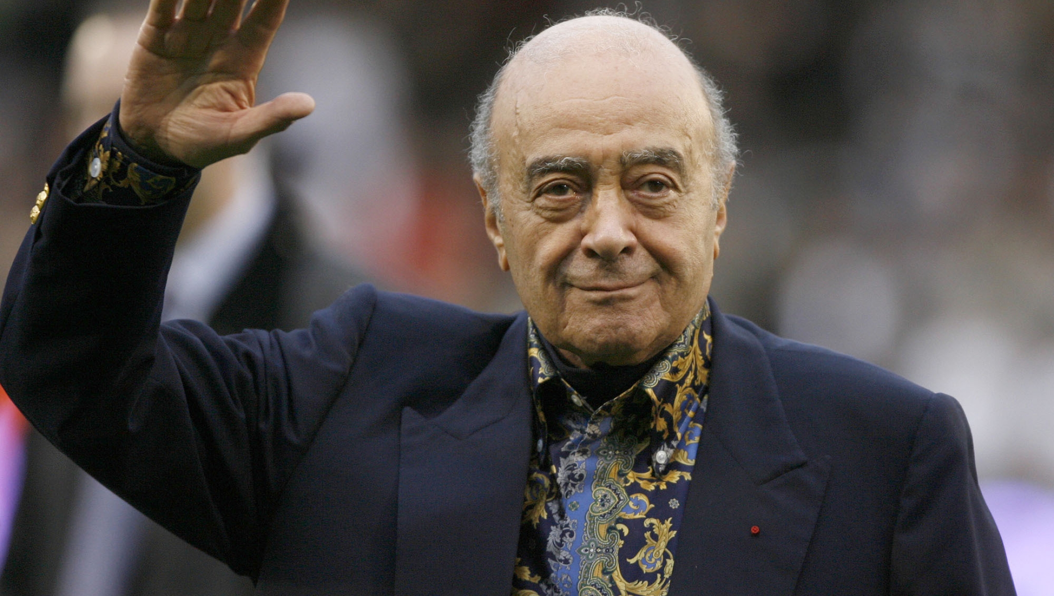 FILE - Fulham owner Mohamed Al Fayed waves to the crowd before the English Premier League soccer match against Tottenham Hotspur at Craven Cottage stadium, London, Nov. 15, 2008. Al Fayed, the former Harrods owner whose son Dodi was killed in a car crash with Princess Diana, has died at age 94. His death was announced Friday, Sept. 1, 2023, by Fulham Football Club, which Al Fayed once owned. (AP Photo/Simon Dawson, File)