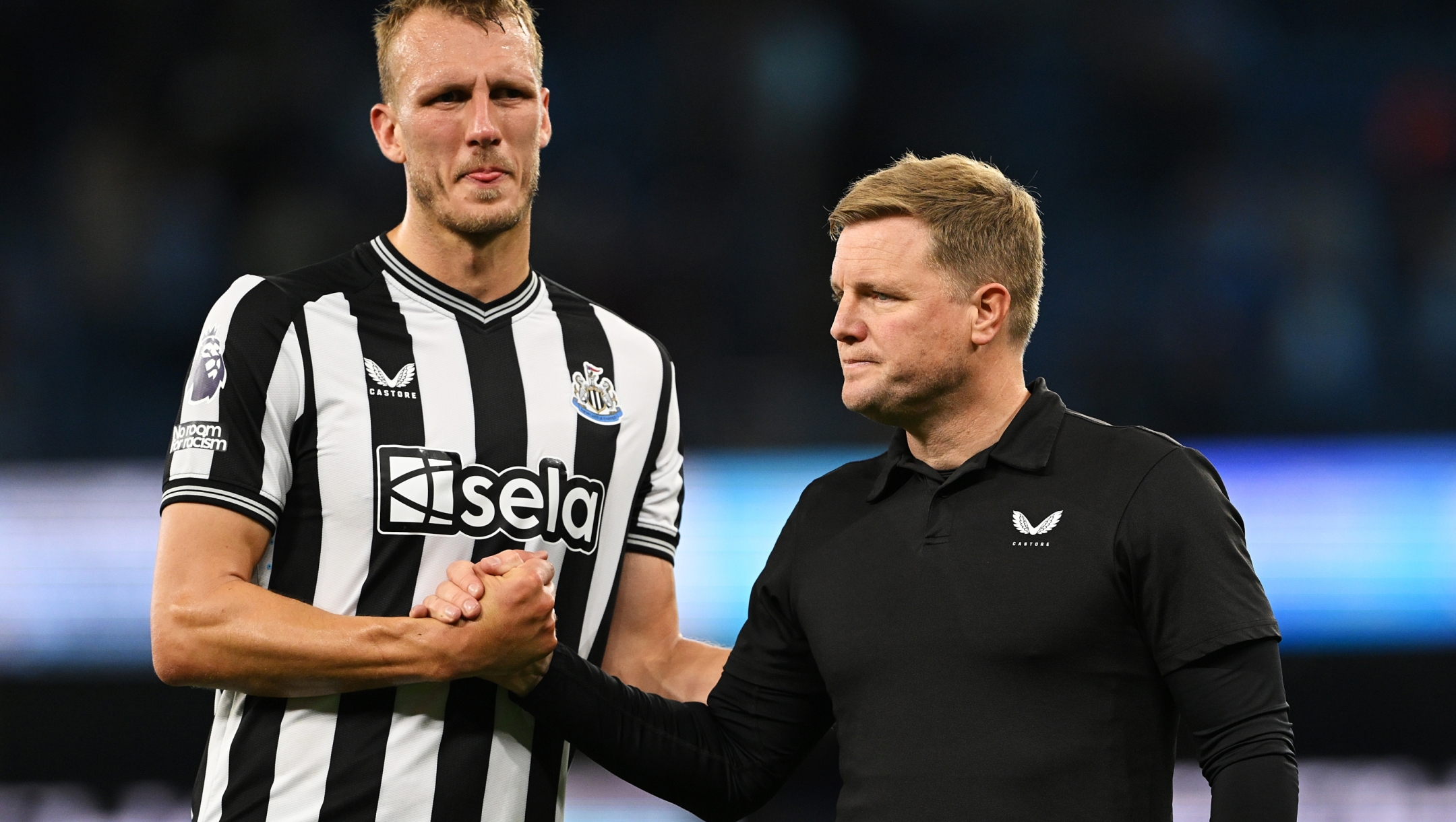 MANCHESTER, ENGLAND - AUGUST 19: Dan Burn of Newcastle United interacts with Eddie Howe, Manager of Newcastle United, following the team's defeat during the Premier League match between Manchester City and Newcastle United at Etihad Stadium on August 19, 2023 in Manchester, England. (Photo by Stu Forster/Getty Images)