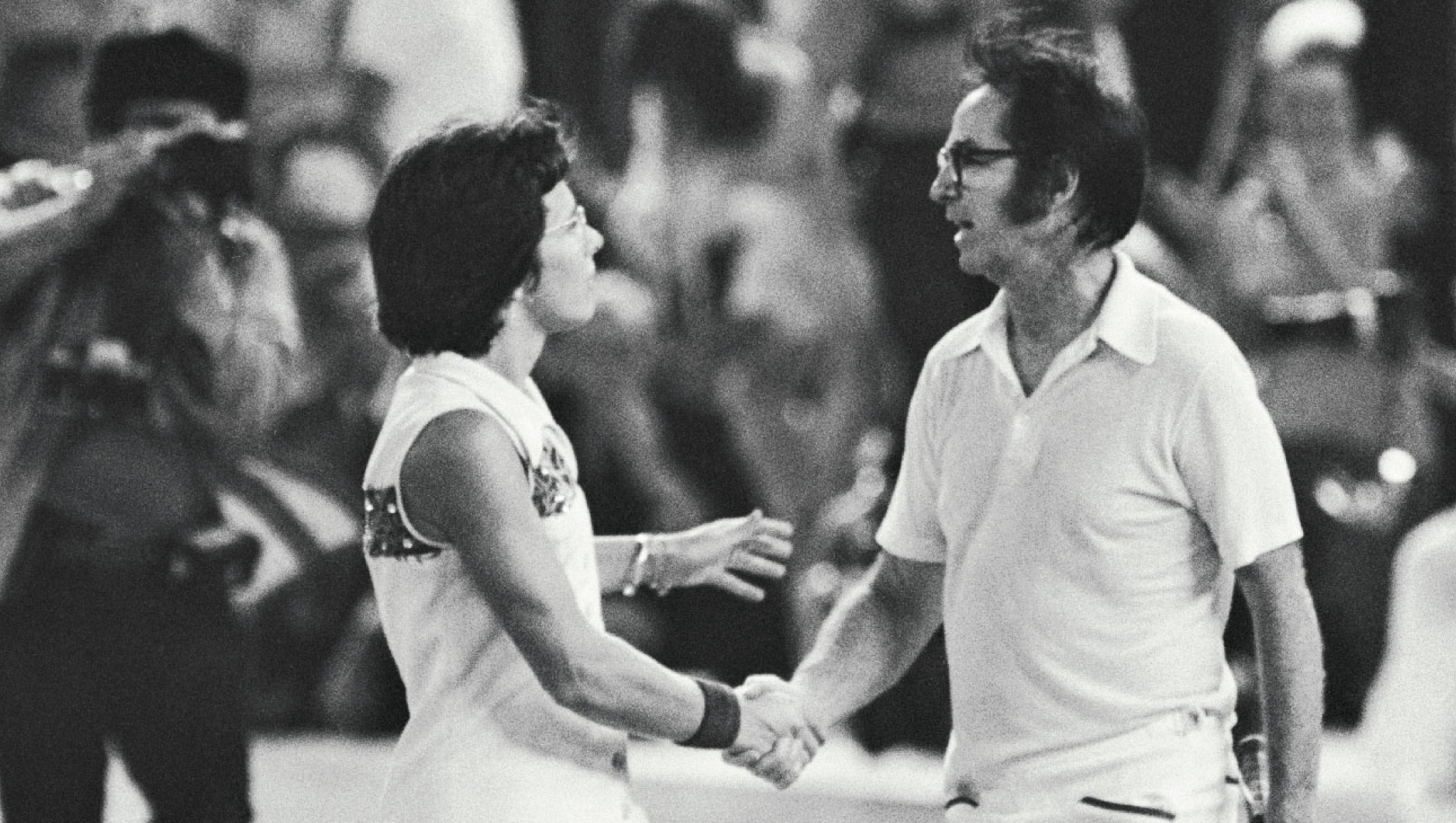 Bobby Riggs and Billie Jean King shake hands after Mrs. King defeated Riggs in straight sets to win the so-called "battle of the sexes" at the Astrodome.