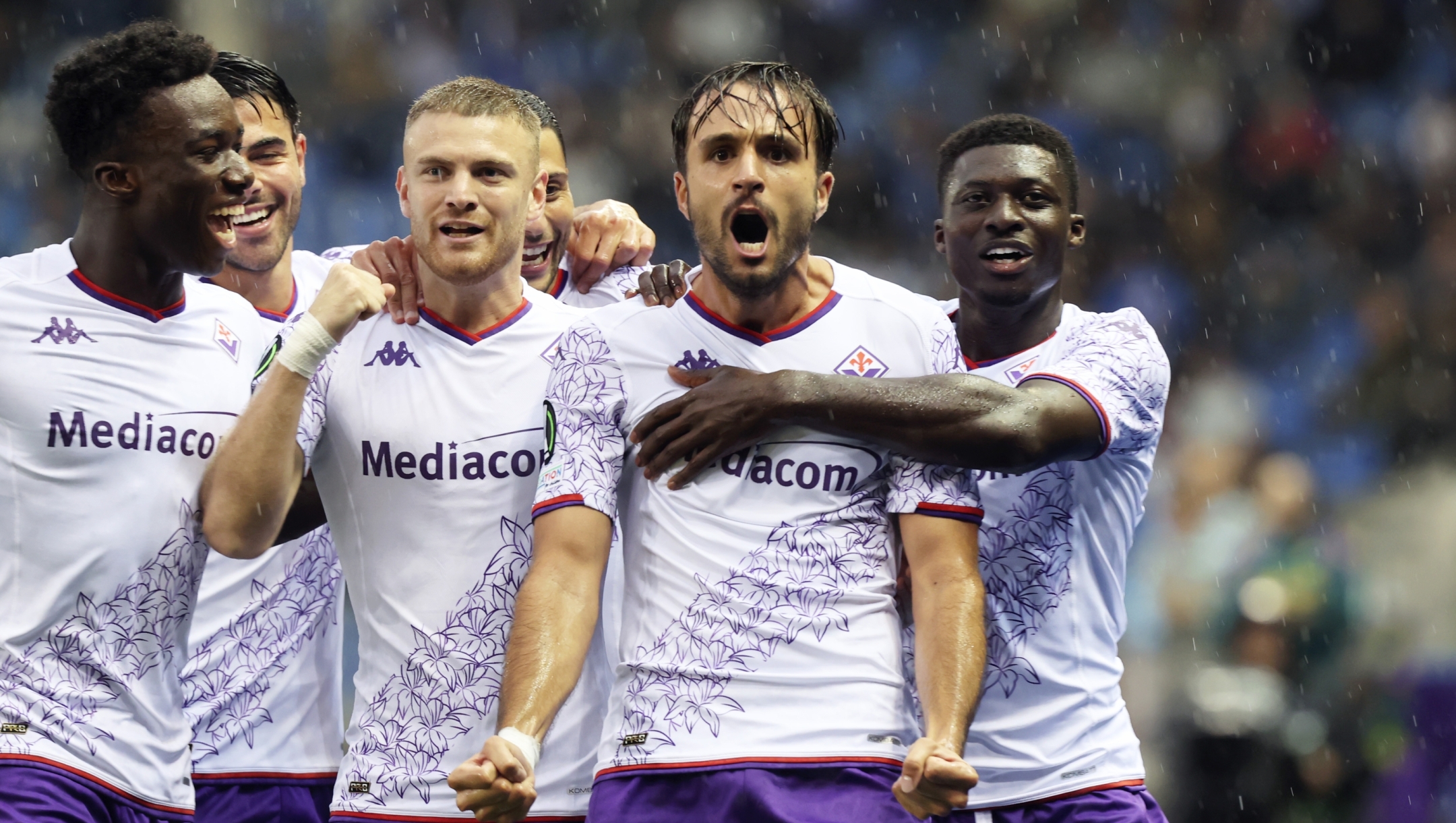 Fiorentina's Luca Ranieri, second right, celebrates after scoring the opening goal during the Europa Conference League Group F soccer match between KRC Genk and AFC Fiorentina at the Genk Arena in Genk, Belgium, Thursday, Sept. 21, 2023. (AP Photo/Francois Walschaerts)