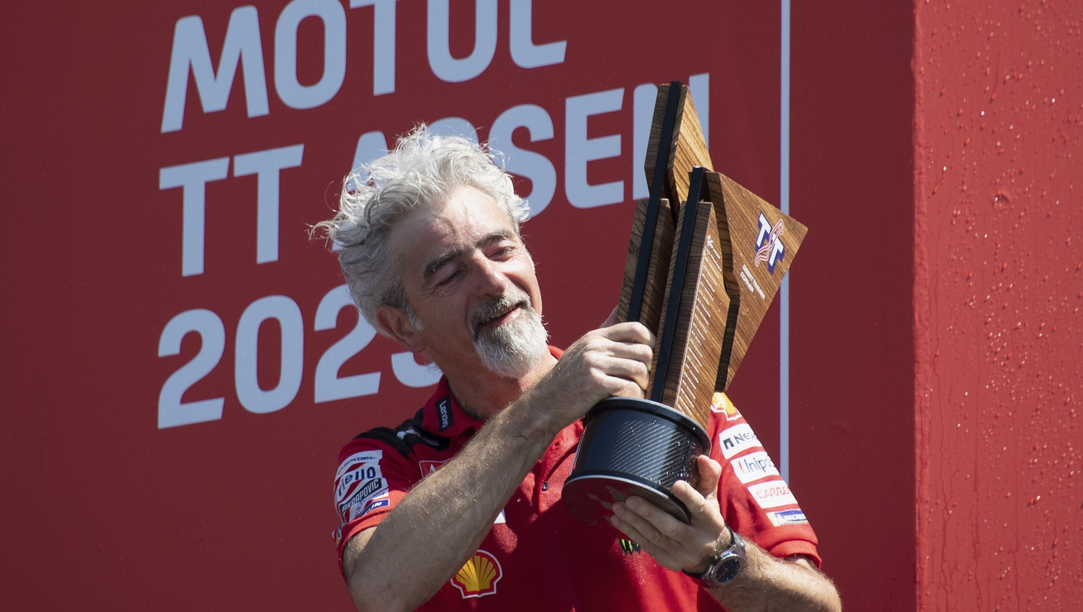 ASSEN, NETHERLANDS - JUNE 25:   Gigi Dall'Igna of Italy and Ducati Team  celebrates the victory on the podium at the end of the MotoGP race during the MotoGP of Netherlands - Race at TT Circuit Assen on June 25, 2023 in Assen, Netherlands. (Photo by Mirco Lazzari gp/Getty Images)