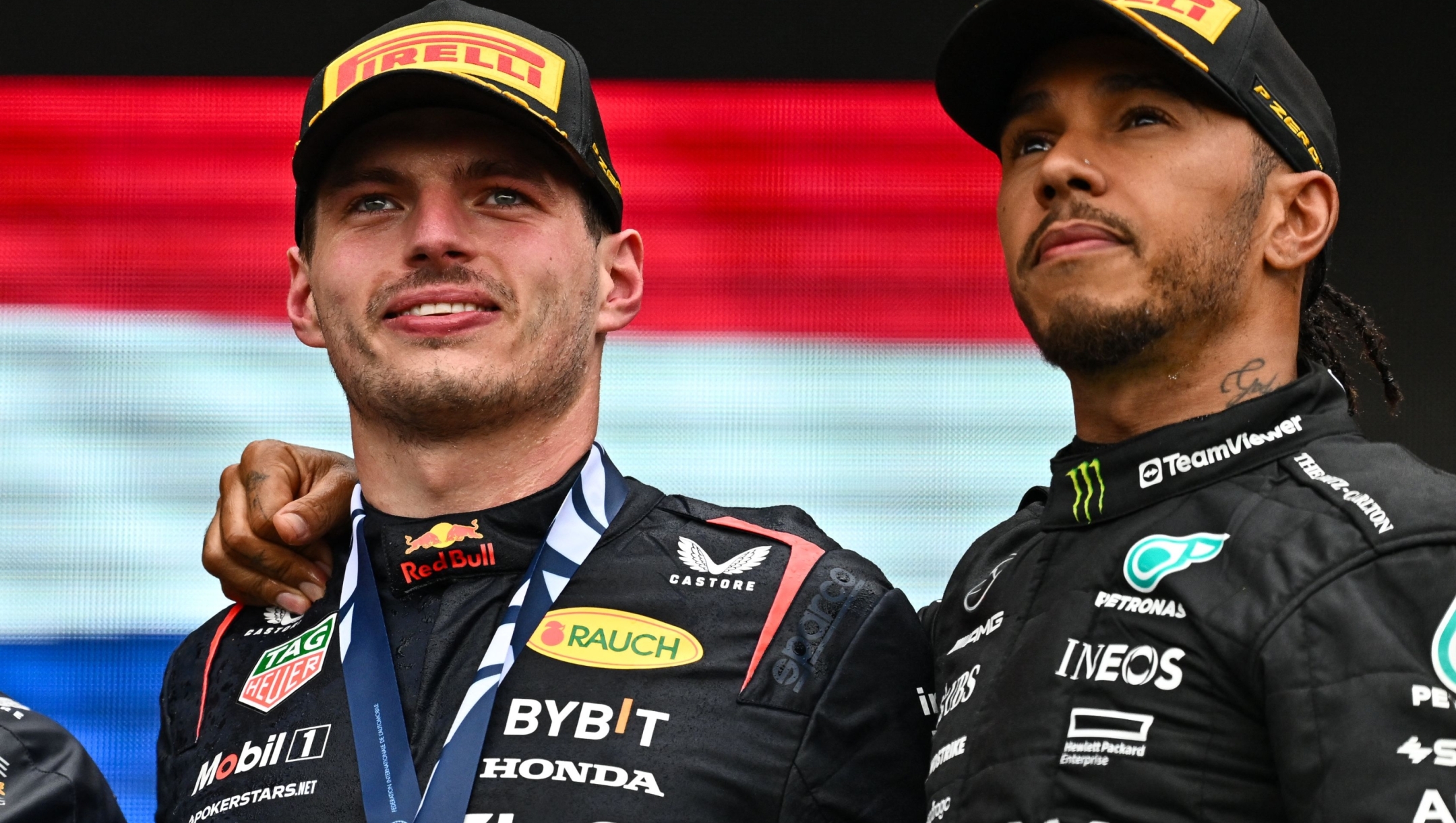 MONTREAL, QUEBEC - JUNE 18: Race winner Max Verstappen of the Netherlands and Oracle Red Bull Racing and Third placed Lewis Hamilton of Great Britain and Mercedes celebrate on the podium during the F1 Grand Prix of Canada at Circuit Gilles Villeneuve on June 18, 2023 in Montreal, Quebec.   Minas Panagiotakis/Getty Images/AFP (Photo by Minas Panagiotakis / GETTY IMAGES NORTH AMERICA / Getty Images via AFP)