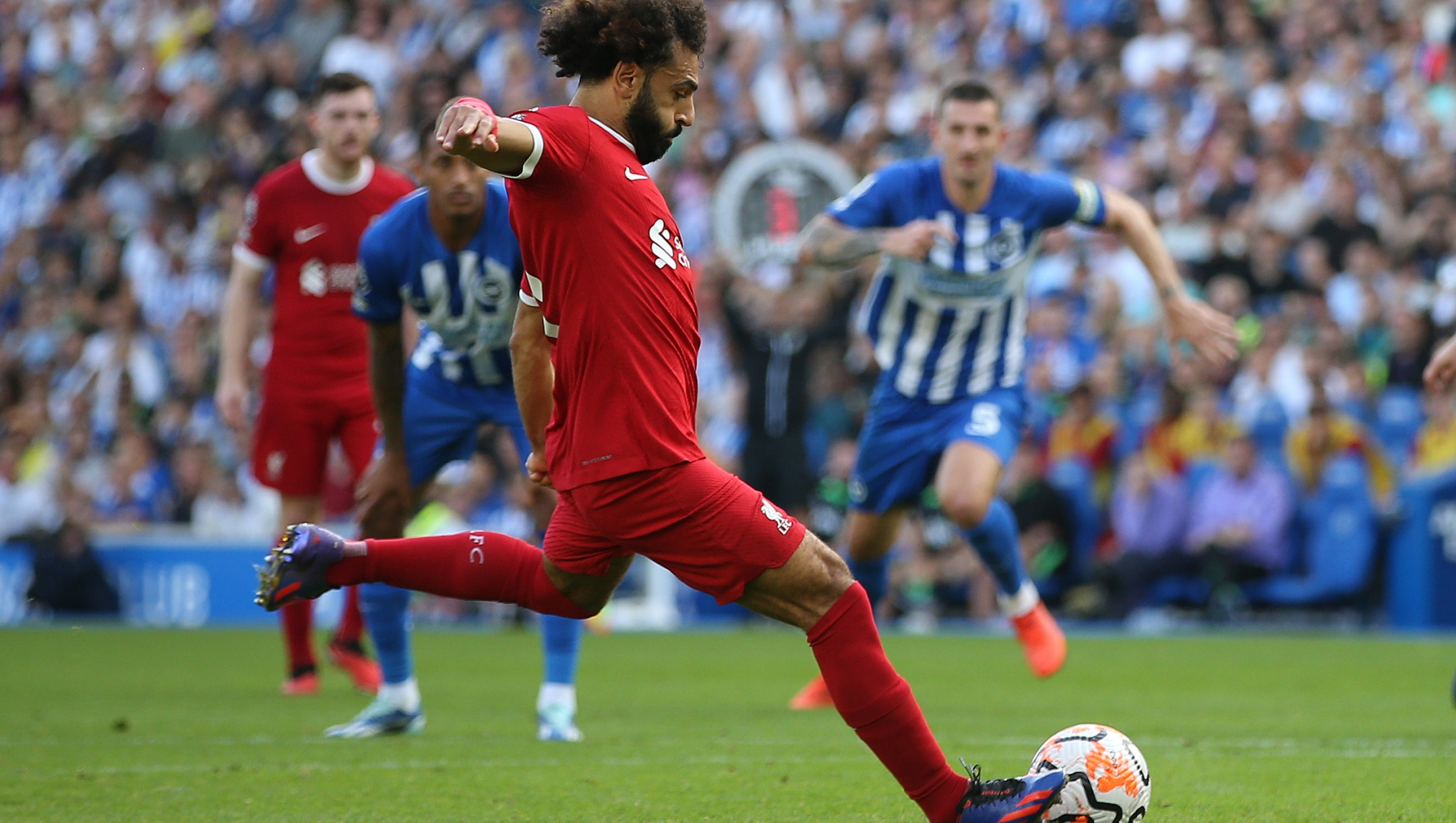 BRIGHTON, ENGLAND - OCTOBER 08: Mohamed Salah of Liverpool scores the team's second goal from a penalty during the Premier League match between Brighton & Hove Albion and Liverpool FC at American Express Community Stadium on October 08, 2023 in Brighton, England. (Photo by Steve Bardens/Getty Images)