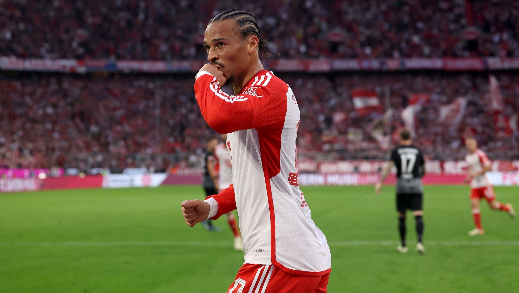 MUNICH, GERMANY - OCTOBER 08: Leroy Sane of FC Bayern München celebrates whilst kissing his ring during the Bundesliga match between FC Bayern München and Sport-Club Freiburg at Allianz Arena on October 08, 2023 in Munich, Germany. (Photo by Alexander Hassenstein/Getty Images)