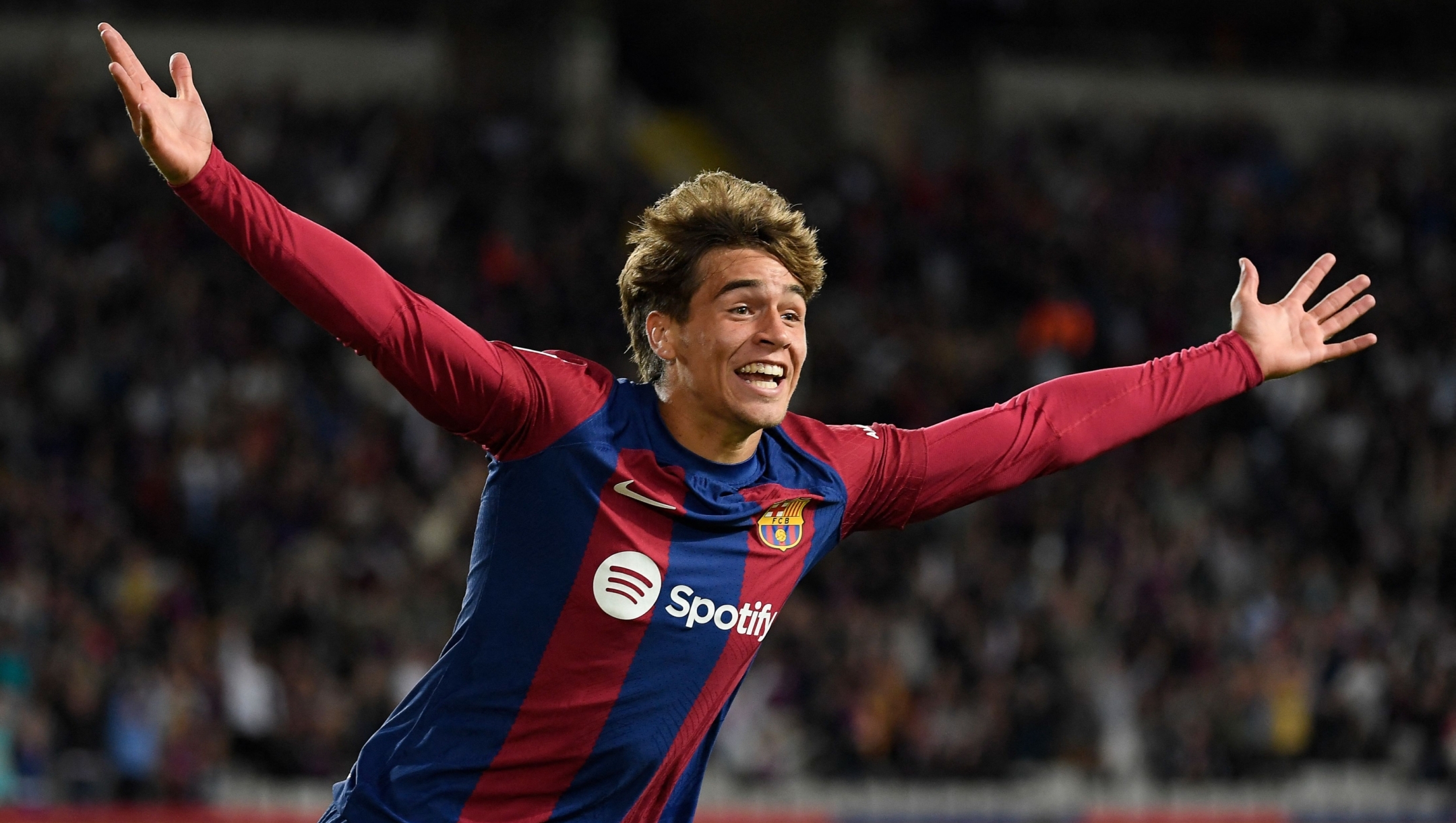 Barcelona's Spanish forward #38 Marc Guiu celebrates after scoring his team's first goal during the Spanish league football match between FC Barcelona and Athletic Club Bilbao at the Estadi Olimpic Lluis Companys in Barcelona on October 22, 2023. (Photo by Josep LAGO / AFP)