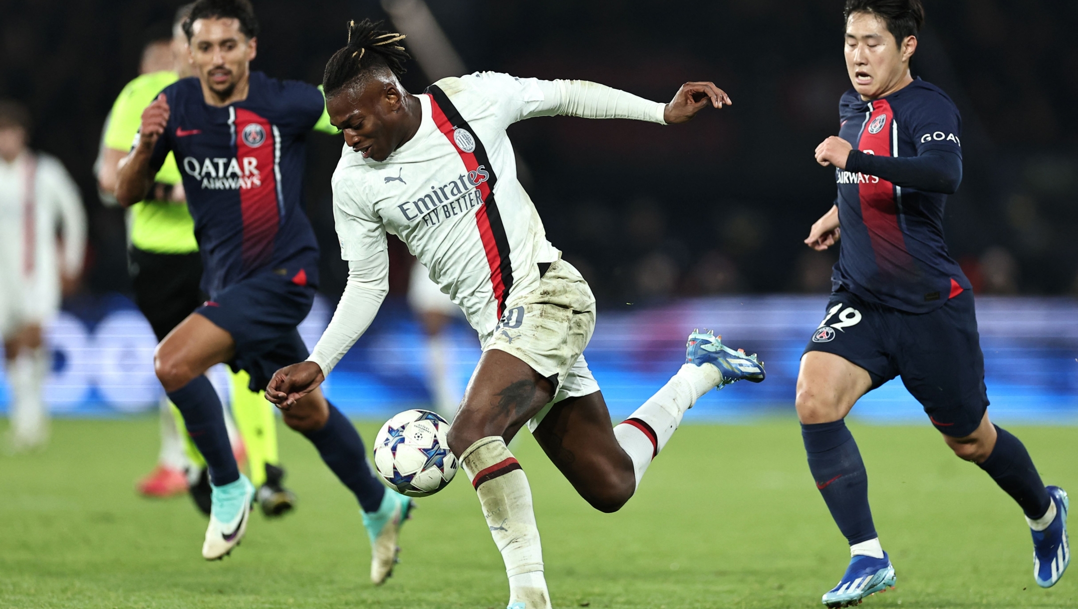 AC Milan's Portuguese forward #10 Rafael Leao fights for the ball with Paris Saint-Germain's Brazilian defender #05 Marquinhos (L) and Paris Saint-Germain's South Korean midfielder #19 Lee Kang-in during the UEFA Champions League Group F football match between Paris Saint-Germain (PSG) and AC Milan at the Parc de Princes in Paris on October 25, 2023. (Photo by FRANCK FIFE / AFP)