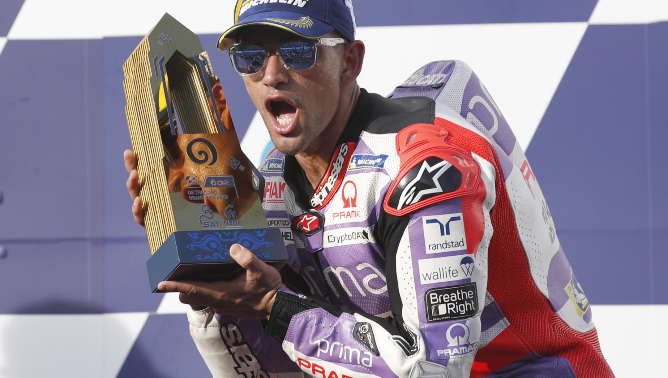 epaselect epa10946871 Spanish MotoGP rider Jorge Martin of Prima Pramac Racing celebrates on a podium after winning the Motorcycling Grand Prix of Thailand at Chang International Circuit, Buriram province, Thailand, 29 October 2023.  EPA/RUNGROJ YONGRIT