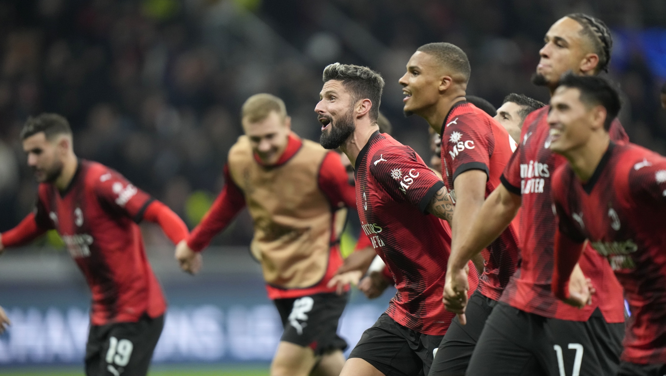 AC Milan players celebrate at the end of the Champions League, Group F soccer match between AC Milan and PSG, at the San Siro stadium in Milan, Italy, Tuesday, Nov. 7, 2023. AC Milan won 2-1. (AP Photo/Luca Bruno)