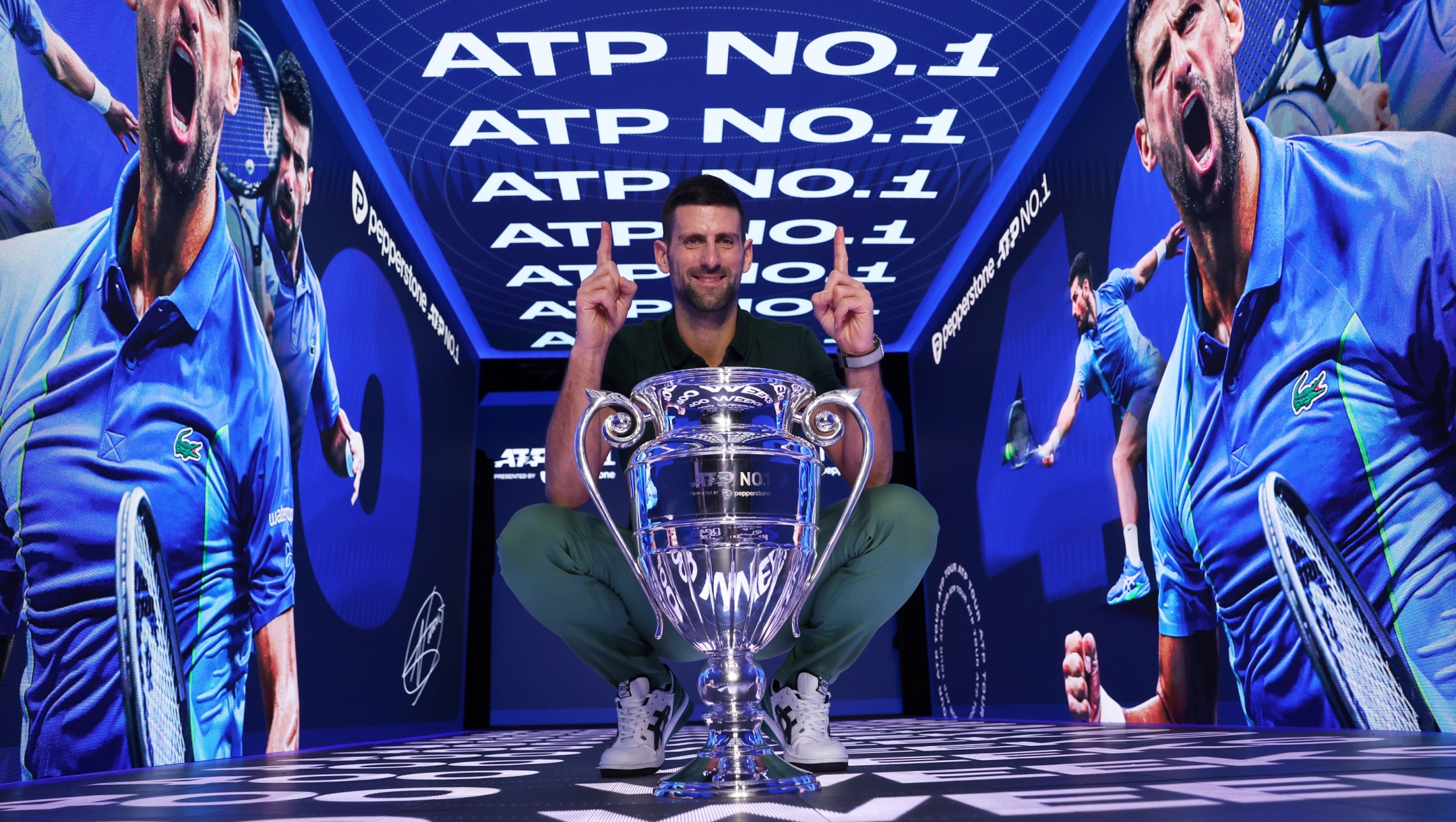 TURIN, ITALY - NOVEMBER 13:  Novak Djokovic of Serbia with the ATP Year End World Number One Trophy and remains The World Number One for a record 400 weeks (as of Monday 20th November) during day two of the Nitto ATP Finals at Pala Alpitour on November 13, 2023 in Turin, Italy. (Photo by Clive Brunskill/Getty Images)