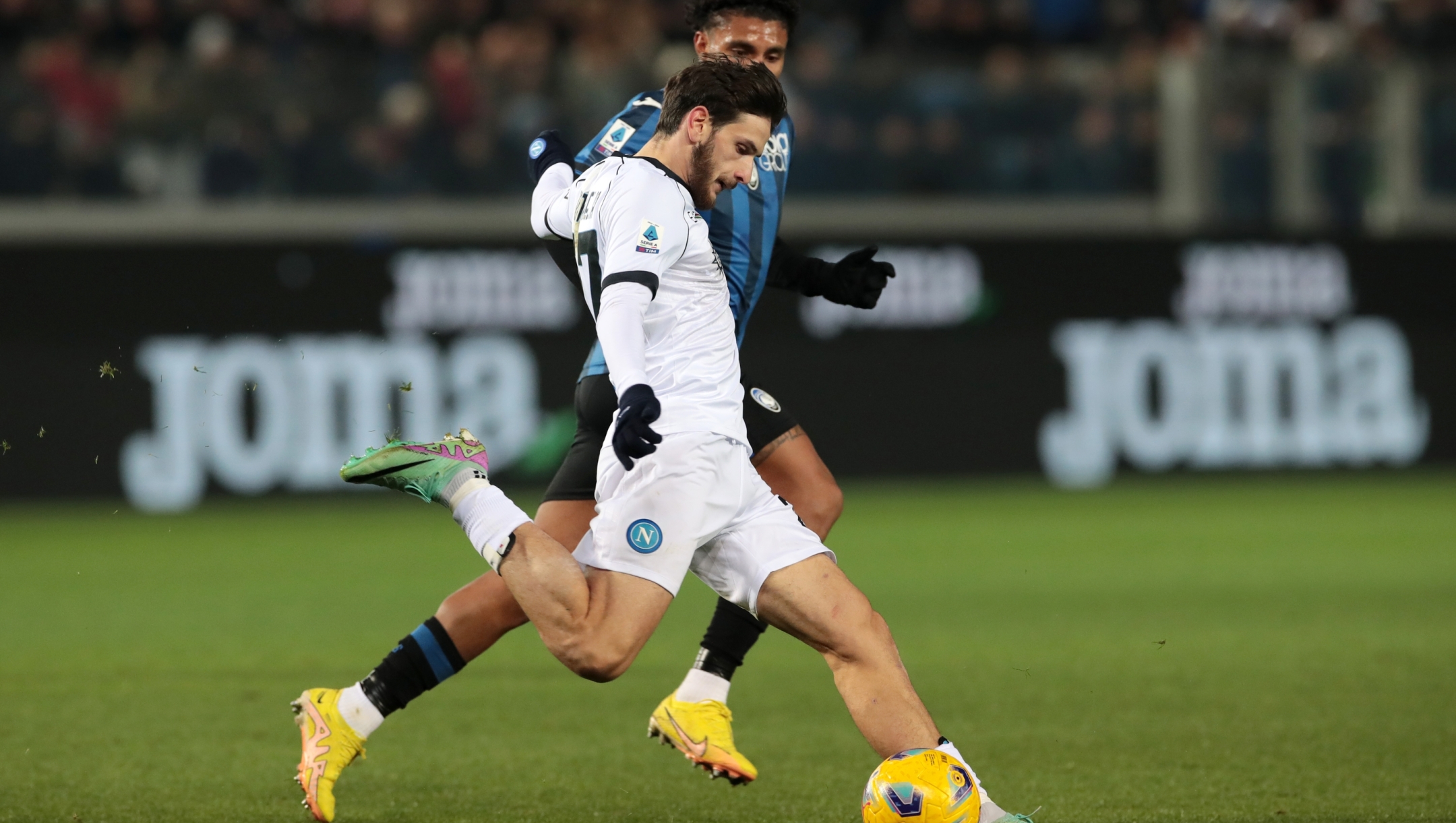 BERGAMO, ITALY - NOVEMBER 25: Khvicha Kvaratskhelia of SSC Napoli runs with the ball whilst under pressure from Ederson of Atalanta BC during the Serie A TIM match between Atalanta BC and SSC Napoli at Gewiss Stadium on November 25, 2023 in Bergamo, Italy. (Photo by Emilio Andreoli/Getty Images)