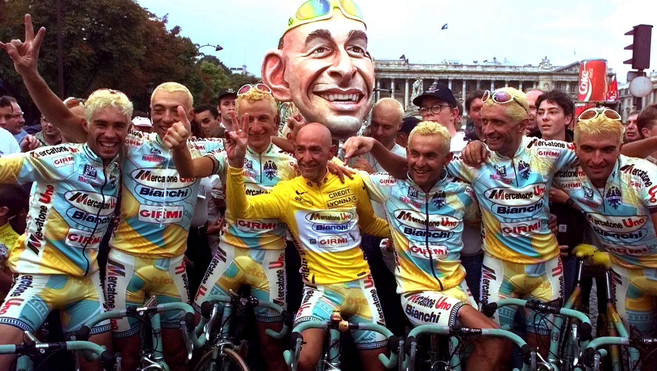 Tour de France winner Marco Pantani, of Italy, and his Mercatone teammates pose on the Concorde Plazza after the 21st and final stage of the  cycling race between Melun and Paris Sunday, August 2, 1998. (AP Photo/Laurent Rebours)