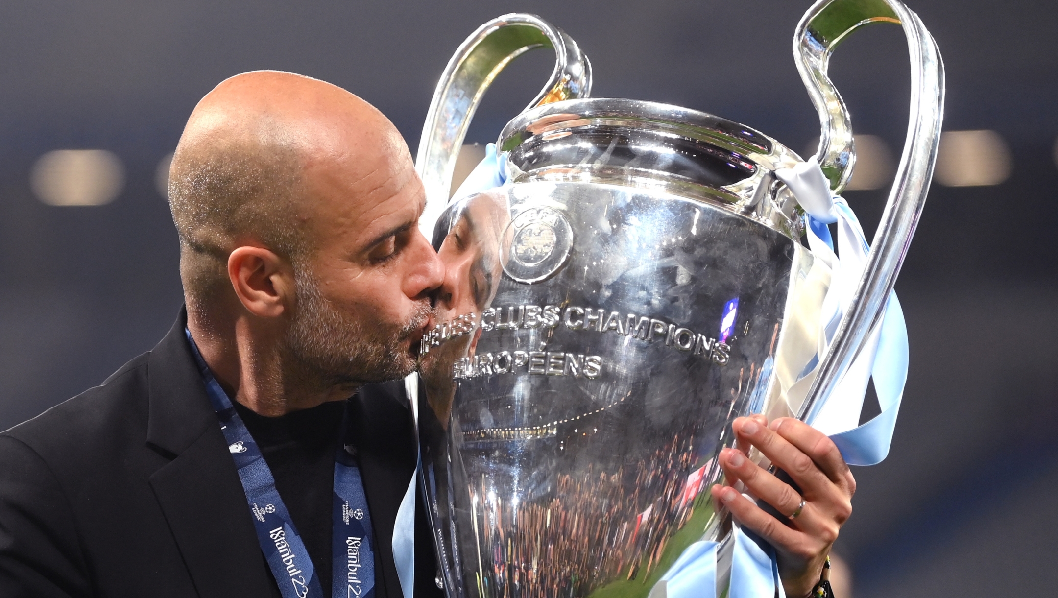 ISTANBUL, TURKEY - JUNE 10: Pep Guardiola, Manager of Manchester City, kisses the UEFA Champions League trophy after the team's victory in the UEFA Champions League 2022/23 final match between FC Internazionale and Manchester City FC at Atatuerk Olympic Stadium on June 10, 2023 in Istanbul, Turkey. (Photo by Shaun Botterill/Getty Images)
