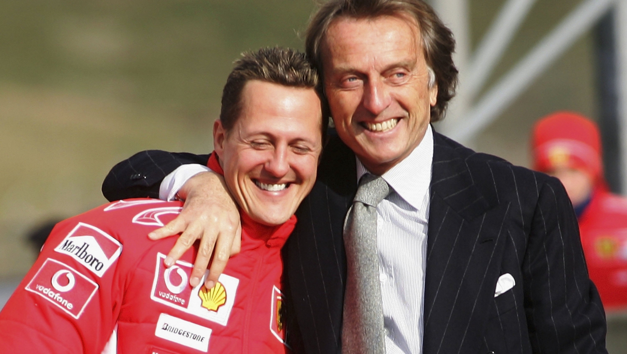 MUGELLO, ITALY - JANUARY 24:  President Luca di Montezemolo of Ferrari hugs his driver Michael Schumacher of Germany during the launch of the new Ferrari F1 car for the Season 2006 on January 24, 2006 in Mugello near Florence, Italy.  (Photo by Vladimir Rys/Bongarts/Getty Images)