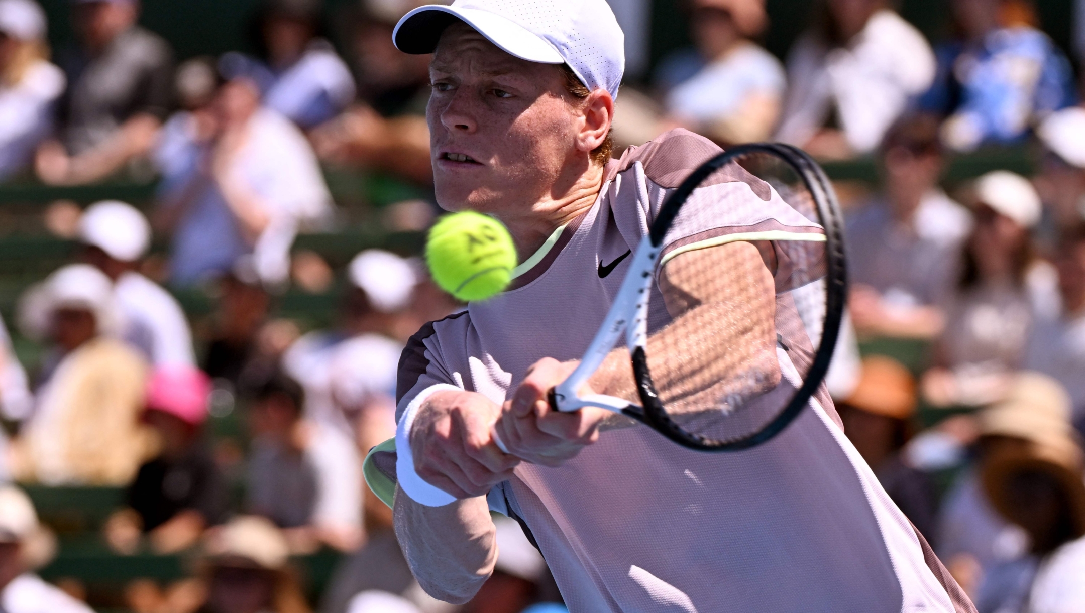 Italy's Jannik Sinner hits a return against Australia's Marc Polmans during their men's singles match at the Kooyong Classic tennis tournment in Melbourne on January 10, 2024. (Photo by William WEST / AFP) / -- IMAGE RESTRICTED TO EDITORIAL USE - STRICTLY NO COMMERCIAL USE --