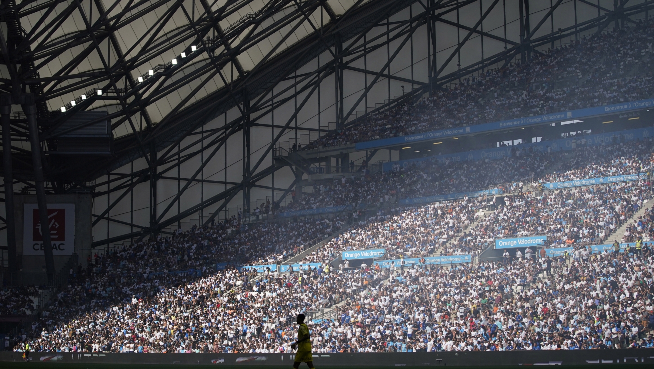 Fans cheer ahead the French League One soccer match between Marseille and Reims at the Velodrome stadium in Marseille, France, Saturday, Aug. 12, 2023. (AP Photo/Daniel Cole)