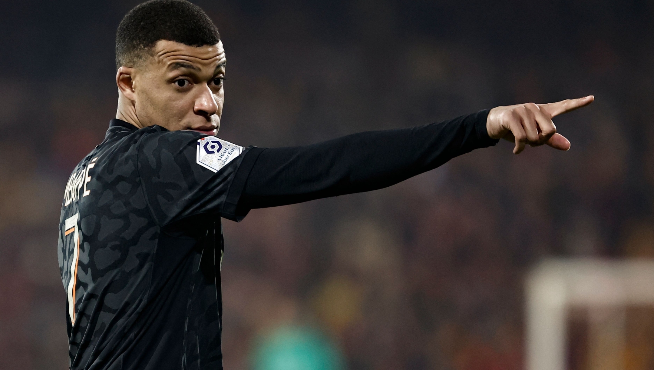 Paris Saint-Germain's French forward #07 Kylian Mbappe reacts during the French L1 football match between RC Lens and Paris Saint-Germain (PSG) at Stade Bollaert-Delelis in Lens, northern France on January 14, 2024. (Photo by Sameer Al-Doumy / AFP)