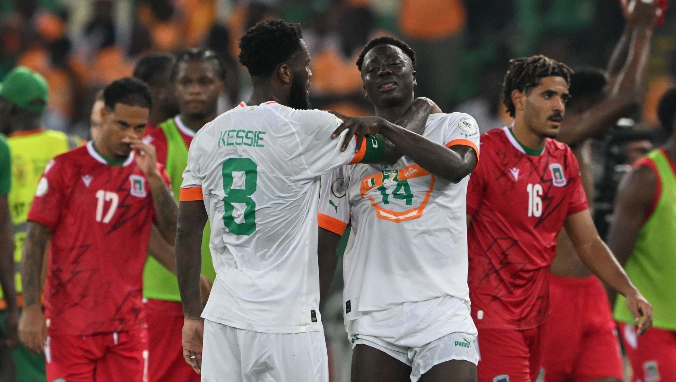 Ivory Coast's midfielder #8 Franck Kessie consoles Ivory Coast's forward #14 Oumar Diakite after Equatorial Guinea won the Africa Cup of Nations (CAN) 2024 group A football match between Equatorial Guinea and Ivory Coast at the Alassane Ouattara Olympic Stadium in Ebimpe, Abidjan on January 22, 2024. (Photo by Issouf SANOGO / AFP)