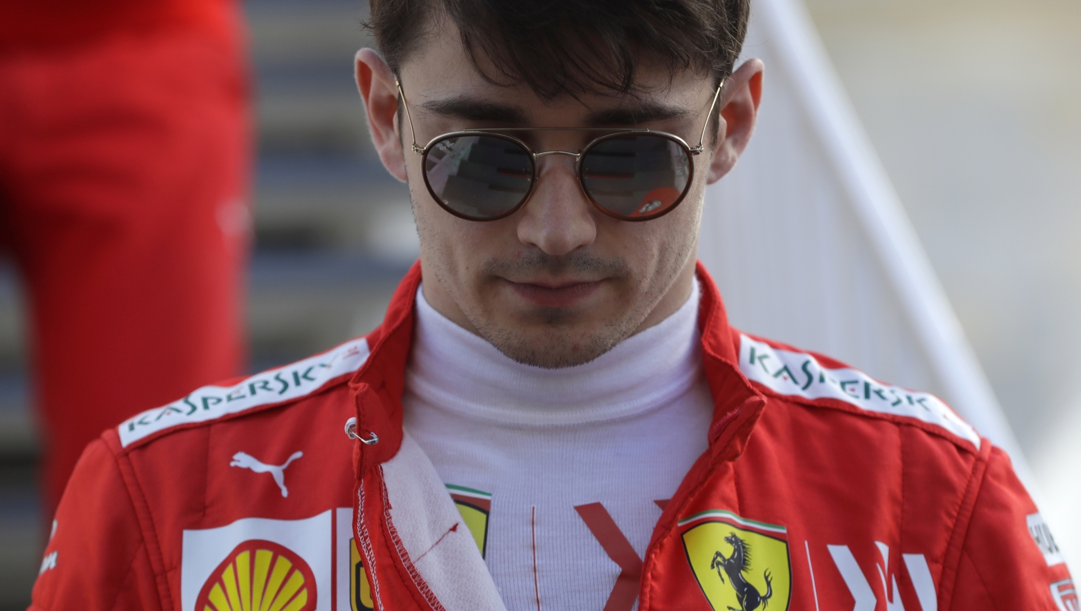FILE - Ferrari driver Charles Leclerc of Monaco walks through the paddock prior to the qualifying session at the Baku Formula One city circuit in Baku, Azerbaijan, Saturday, April 27, 2019. Leclerc has signed a new multi-year contract with Ferrari on Thursday, Jan. 25, 2024. Ferrari has not revealed the length of Leclerc’s new contract but he says he will stay with the famous Scuderia for “several more seasons.”  (AP Photo/Sergei Grits, File)