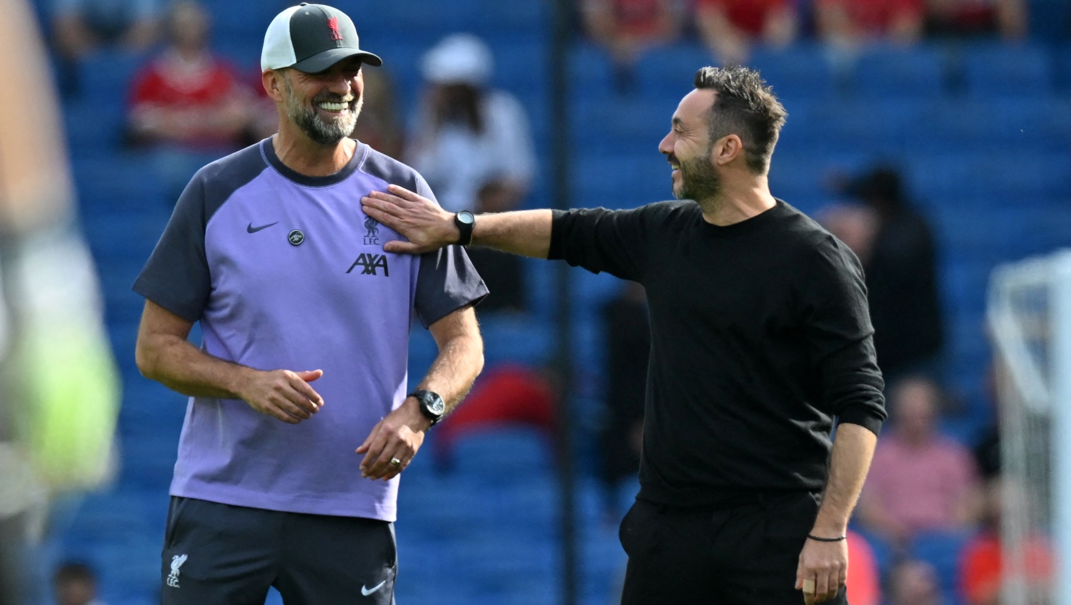 Liverpool's German manager Jurgen Klopp (L) shares a moment with Brighton's Italian head coach Roberto De Zerbi (R) ahead of the English Premier League football match between Brighton and Hove Albion and Liverpool at the American Express Community Stadium in Brighton, southern England on October 8, 2023. (Photo by Glyn KIRK / AFP) / RESTRICTED TO EDITORIAL USE. No use with unauthorized audio, video, data, fixture lists, club/league logos or 'live' services. Online in-match use limited to 120 images. An additional 40 images may be used in extra time. No video emulation. Social media in-match use limited to 120 images. An additional 40 images may be used in extra time. No use in betting publications, games or single club/league/player publications. /