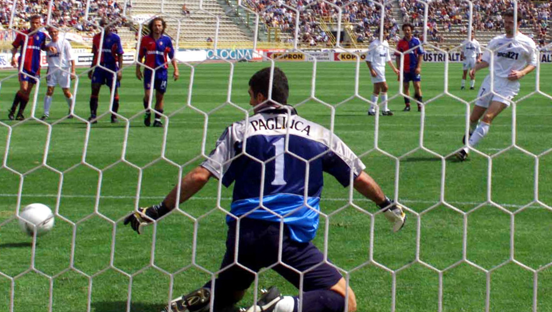 Lecce's Davor Vugrinec of Croatia, right, kicks to score against Bologna's goalkeeper Gianluca Pagliuca during the Italian first league serie A Bologna vs Lecce soccer match, Bologna, northern Italy, Sunday, June 10, 2001. The match ended 2 - 2. (AP Photo/ Renato Ferrini)
