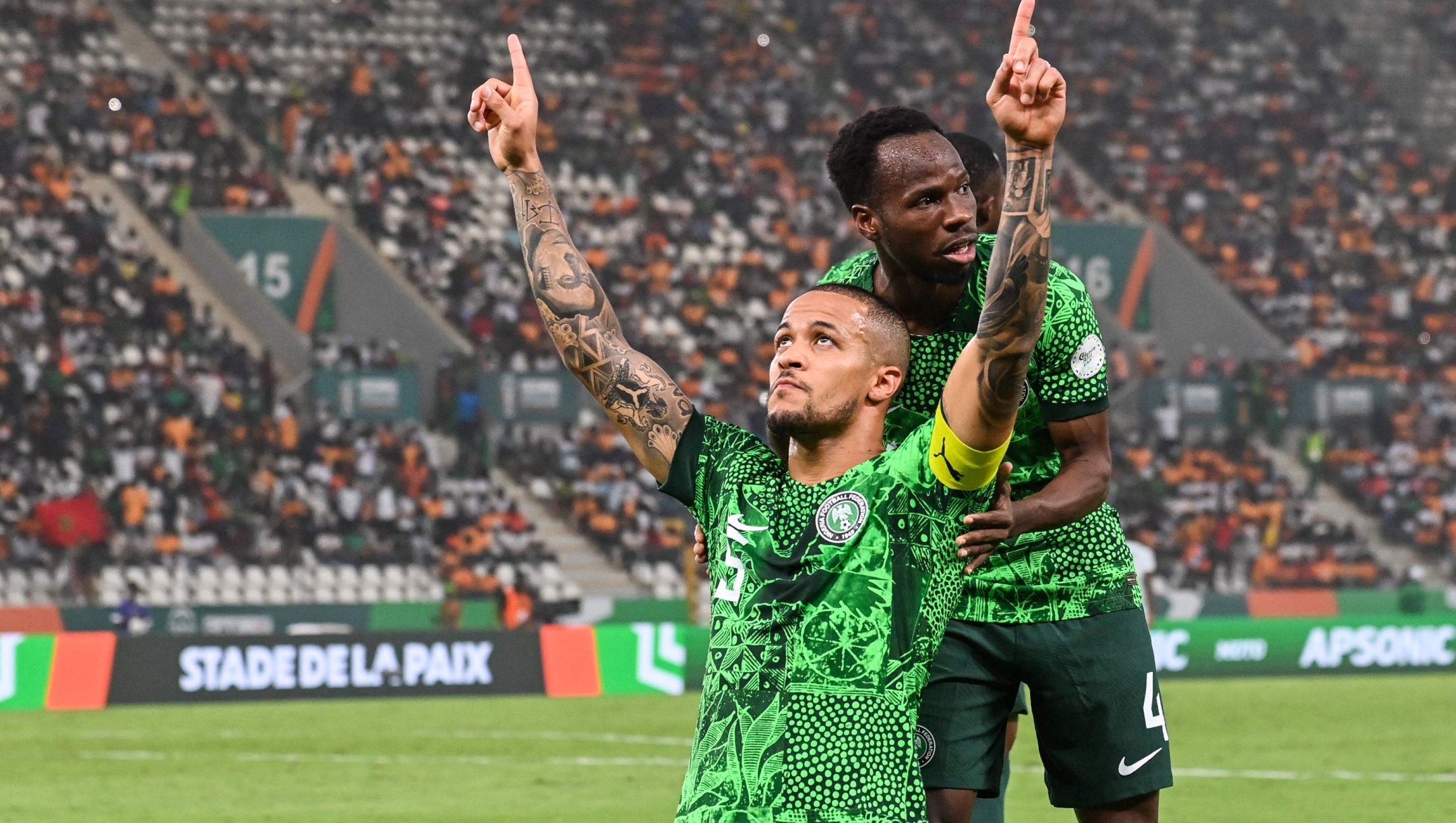 Nigeria's defender #5 William Troost-Ekong (L) celebrates after scoring his team's first goal from the penalty spot during the Africa Cup of Nations (CAN) 2024 semi-final football match between Nigeria and South Africa at the Stade de la Paix in Bouake on February 7, 2024. (Photo by Issouf SANOGO / AFP)