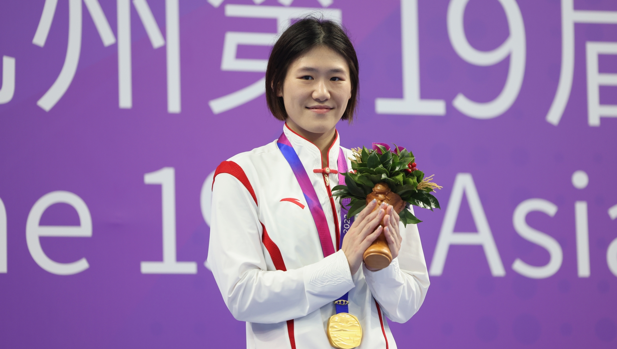 HANGZHOU, CHINA - SEPTEMBER 28: Gold medallist Ye Shiwen of China celebrates during the medals ceremony for the women's 200m breaststroke swimming event during the Hangzhou 2022 Asian Games on September 28, 2023 in Hangzhou, China. (Photo by Lintao Zhang/Getty Images)