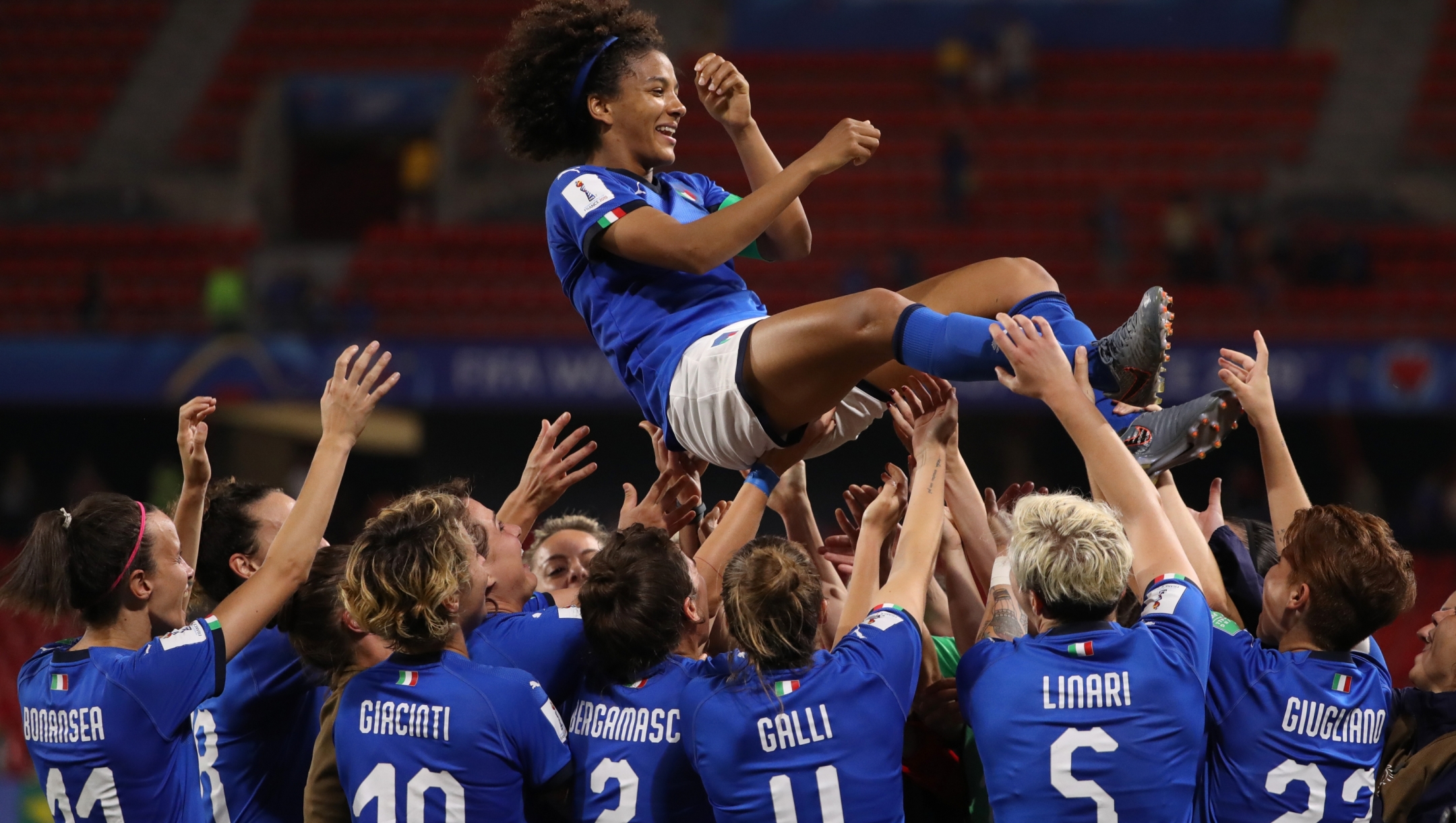 VALENCIENNES, FRANCE - JUNE 18: Sara Gama of Italy is thrown in the air by her teammates following the 2019 FIFA Women's World Cup France group C match between Italy and Brazil at Stade du Hainaut on June 18, 2019 in Valenciennes, France. (Photo by Robert Cianflone/Getty Images)