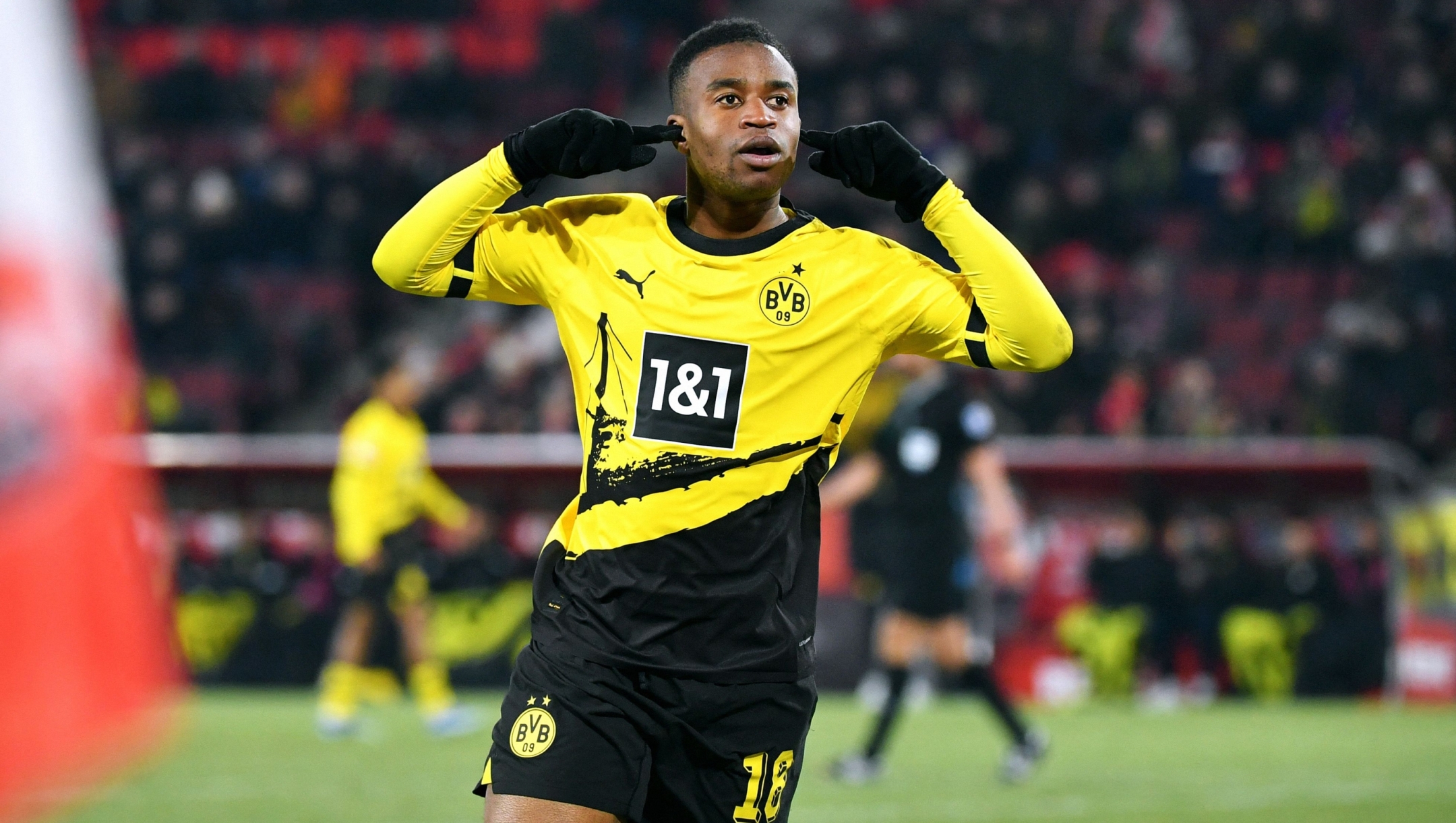Dortmund's German forward #18 Youssoufa Moukoko celebrates his 0-4 during the German first division Bundesliga football match between FC Cologne and Borussia Dortmund in Cologne on January 20, 2024. (Photo by Uwe KRAFT / AFP) / DFL REGULATIONS PROHIBIT ANY USE OF PHOTOGRAPHS AS IMAGE SEQUENCES AND/OR QUASI-VIDEO