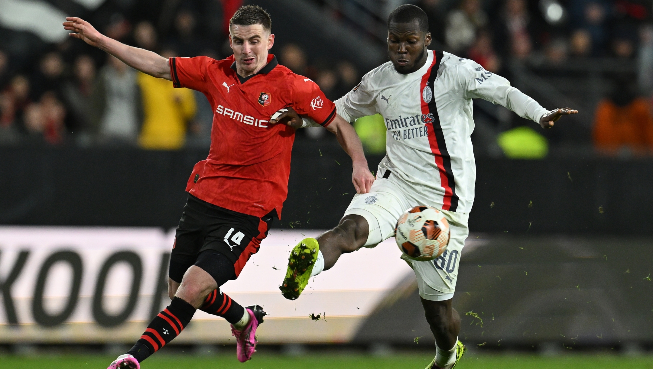 RENNES, FRANCE - FEBRUARY 22:  Yunus Musah  of AC Milan competes for the ball with Benjamin Bourigeaud of Stade Rennais FC during the UEFA Europa League 2023/24 playoff second leg match between Stade Rennais FC and AC Milan at Roazhon Park on February 22, 2024 in Rennes, France. (Photo by Claudio Villa/AC Milan via Getty Images)