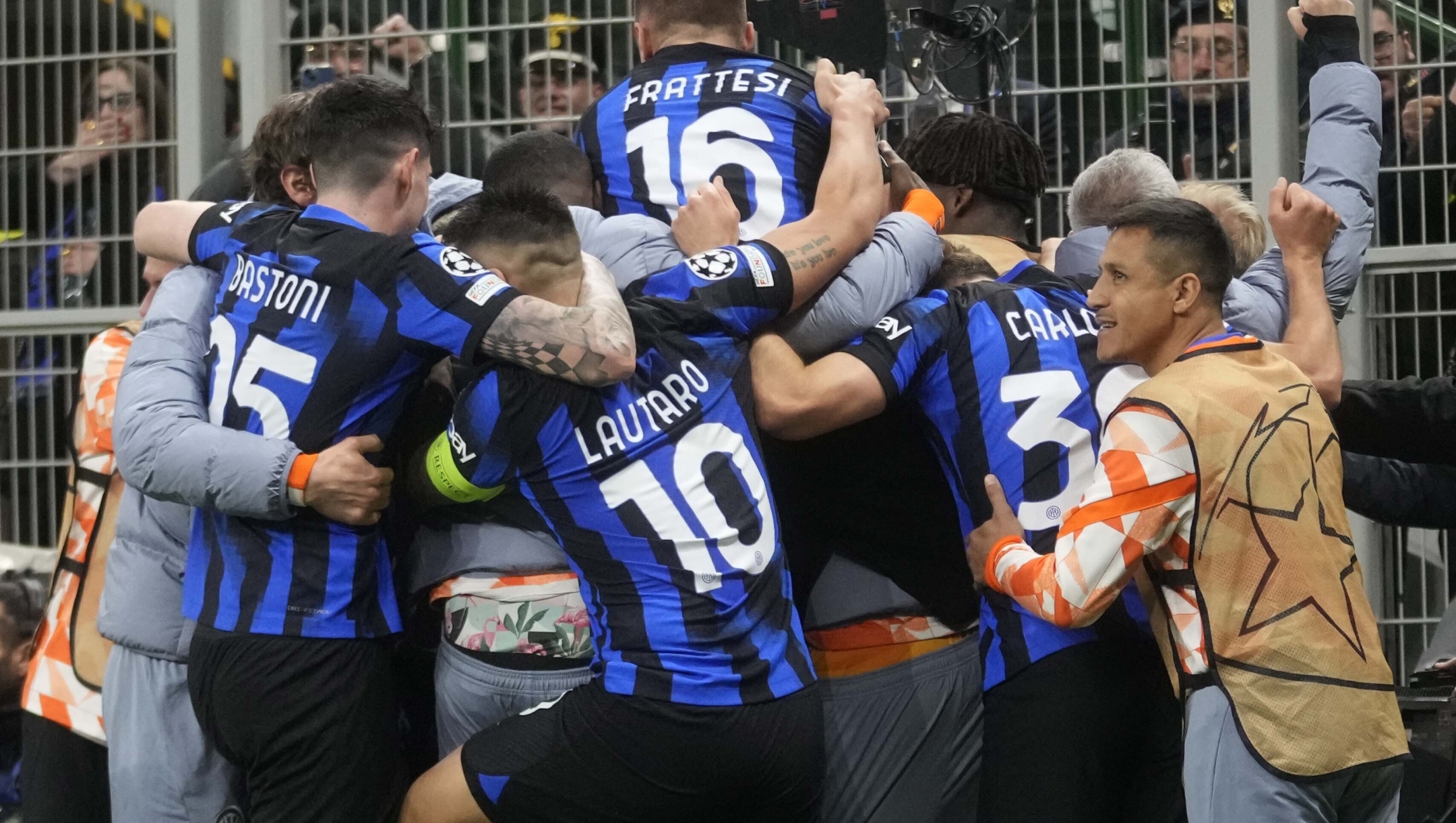 Inter Milan's Marko Arnautovic celebrates with team mates after scoring his side's opening goal during the Champions League, round of 16, first leg soccer match between Inter Milan and Atletico Madrid, at the San Siro stadium in Milan, Italy, Tuesday, Feb. 20, 2024. (AP Photo/Luca Bruno)