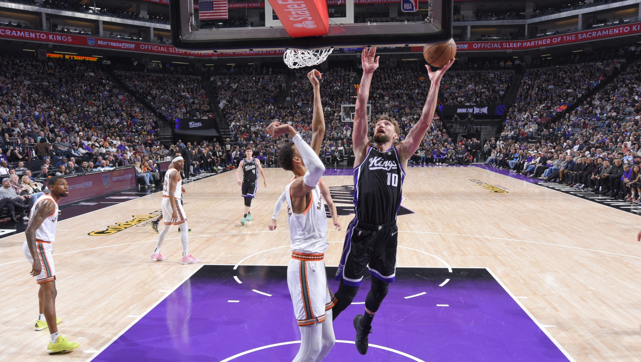 SACRAMENTO, CA - FEBRUARY 22: Domantas Sabonis #10 of the Sacramento Kings drives to the basket during the game against the San Antonio Spurs on February 22, 2024 at Golden 1 Center in Sacramento, California. NOTE TO USER: User expressly acknowledges and agrees that, by downloading and or using this Photograph, user is consenting to the terms and conditions of the Getty Images License Agreement. Mandatory Copyright Notice: Copyright 2023 NBAE   Rocky Widner/NBAE via Getty Images/AFP (Photo by ROCKY WIDNER / NBAE / Getty Images / Getty Images via AFP)