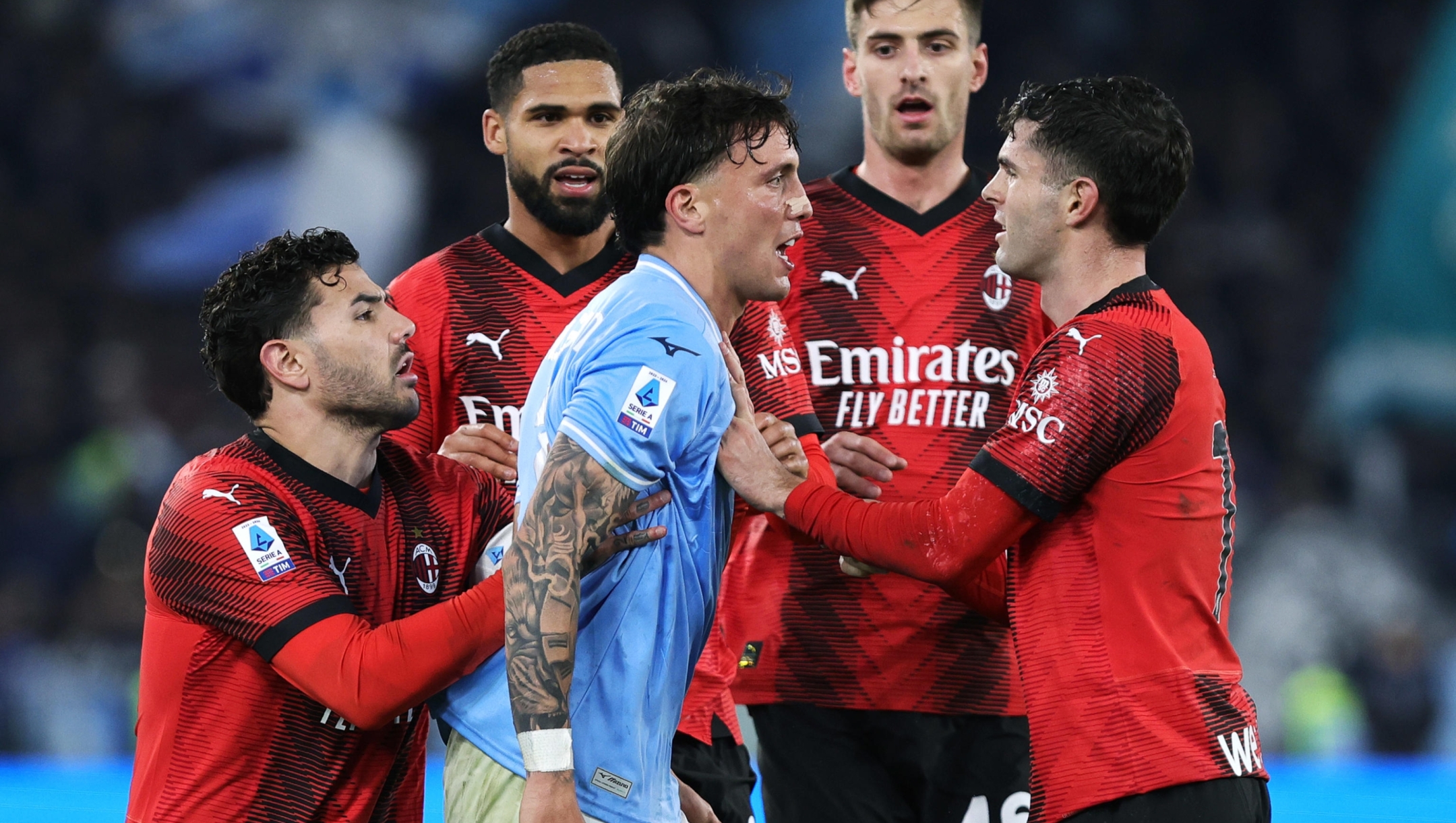Luca Pellegrini of Lazio argues with Christian Pulisic of Milan during the Italian Serie A soccer match between SS Lazio and AC Milan at Olimpico Stadium in Rome, Italy, 1 March 2024. ANSA/FEDERICO PROIETTI