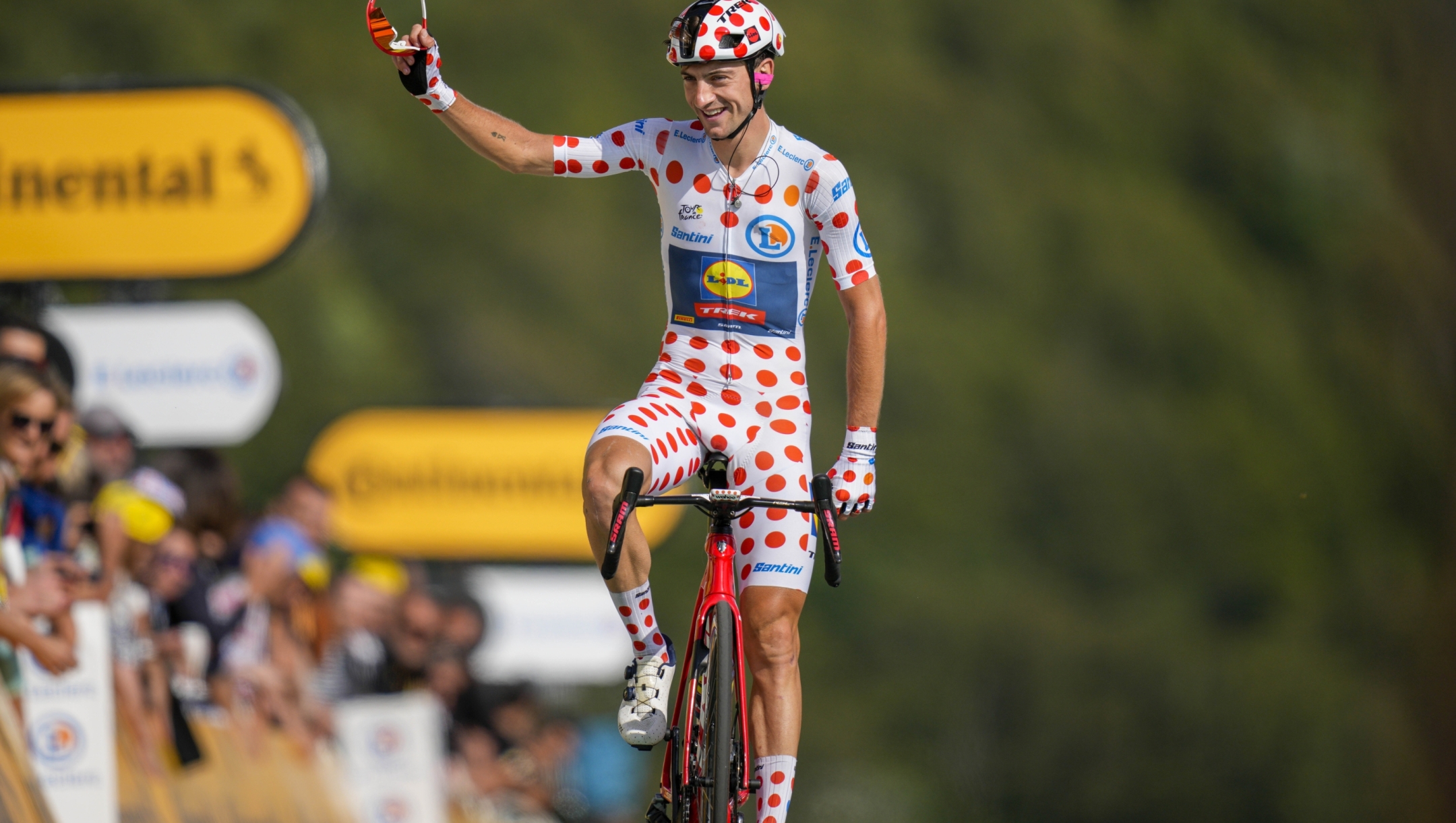 Italy's Giulio Ciccone, wearing the best climber's dotted jersey, celebrates winning the best climbers dotted jersey as he crosses the finish line of the twentieth stage of the Tour de France cycling race over 133.5 kilometers (83 miles) with start in Belfort and finish in Le Markstein Fellering, France, Saturday, July 22, 2023. (AP Photo/Daniel Cole)