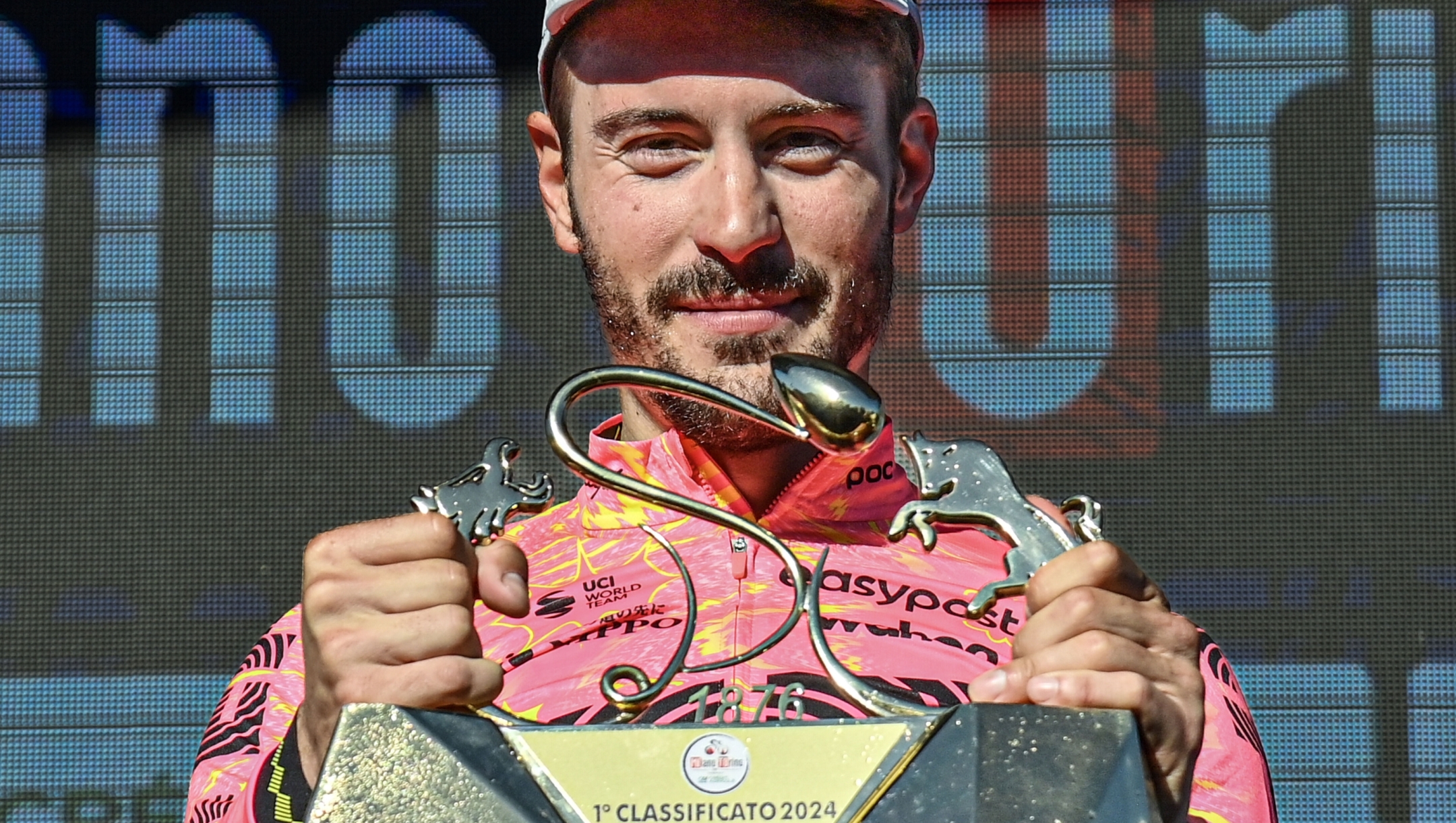 Alberto Bettiol (EF EDUCATION - EASYPOST) celebrates with the trophy his victory on the podium after winning the men's elite race of the Milano-Torino one day cycling race (177km) from Rho and to Salassa - North West Italy - Wednesday, March 13, 2024. Sport, Cycling. (Photo by Gian Mattia D'Alberto/LaPresse)