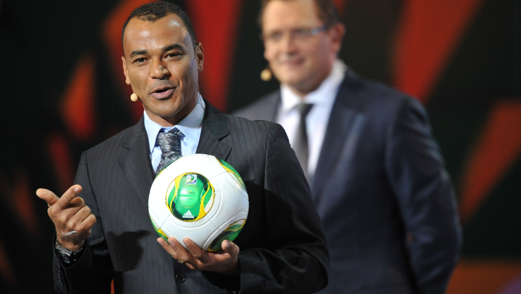Legendary former Brazil skipper Cafu presents the official ball of the Confederation Cup "Cafusa", during the draw for next June's Confederations Cup Brazil 2013 -- a dress rehearsal for the 2014 World Cup football -- in Sao Paulo, Brazil, on December 1, 2012. The eight-nation event in Brazil brings together four former world champions in reigning top-ranked side Spain, Brazil, Italy and Uruguay. AFP PHOTO / YASUYOSHI CHIBA