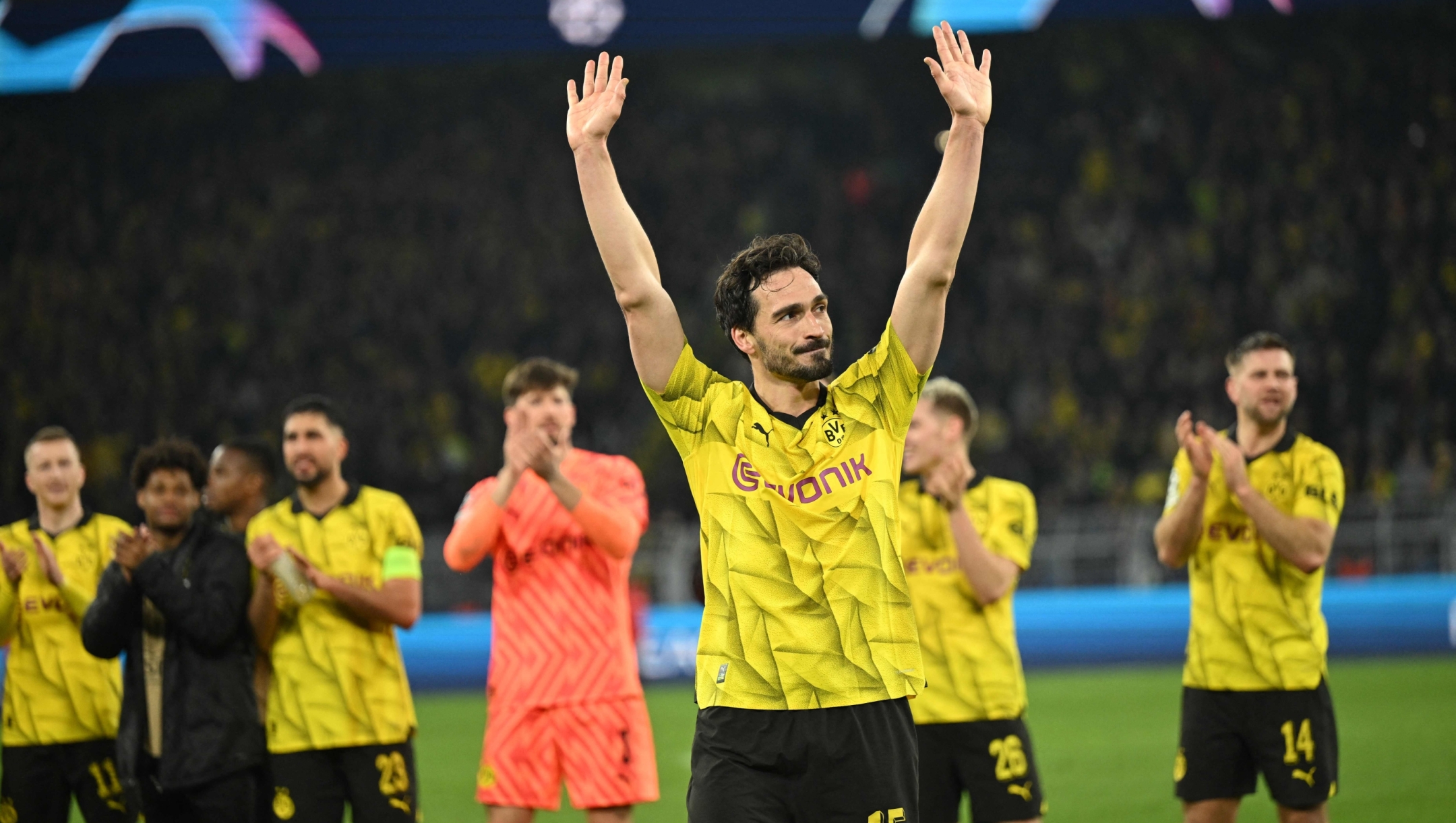 Dortmund's German defender #15 Mats Hummels celebrates with team after winning the UEFA Champions League quarter-final second leg football match between Borussia Dortmund and Atletico Madrid in Dortmund, western Germany on April 16, 2024. (Photo by INA FASSBENDER / AFP)