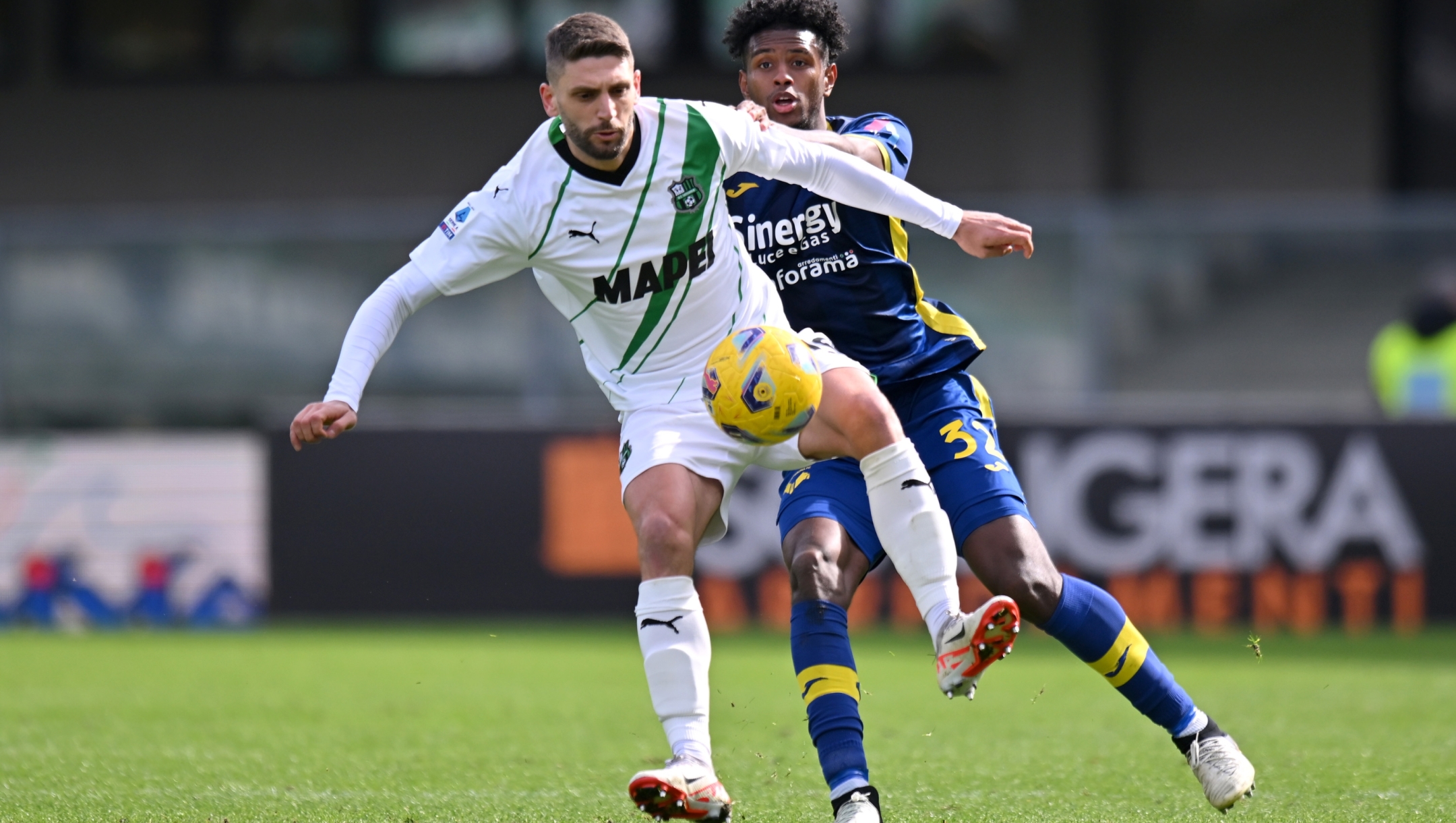 VERONA, ITALY - MARCH 03: Domenico Berardi of US Sassuolo is challenged by Juan Cabal of Hellas Verona FC during the Serie A TIM match between Hellas Verona FC and US Sassuolo - Serie A TIM  at Stadio Marcantonio Bentegodi on March 03, 2024 in Verona, Italy. (Photo by Alessandro Sabattini/Getty Images)