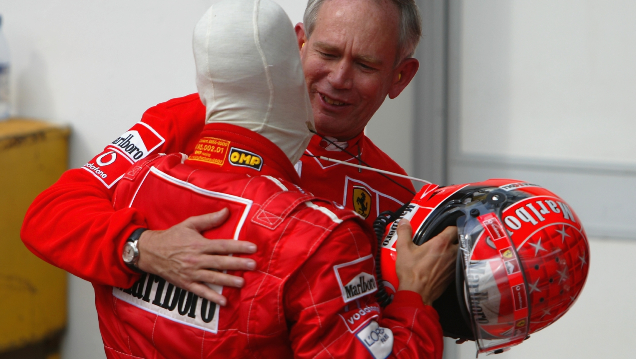 IMOLA - APRIL 14:  Ferrari driver Michael Schumacher of Germany celebrates victory with Ferrari Chief Designer Rory Byrne after the San Marino Formula One Grand Prix held in Imola, Italy on April 14, 2002. DIGITAL IMAGE. (Photo by Mark Thompson/Getty Images)