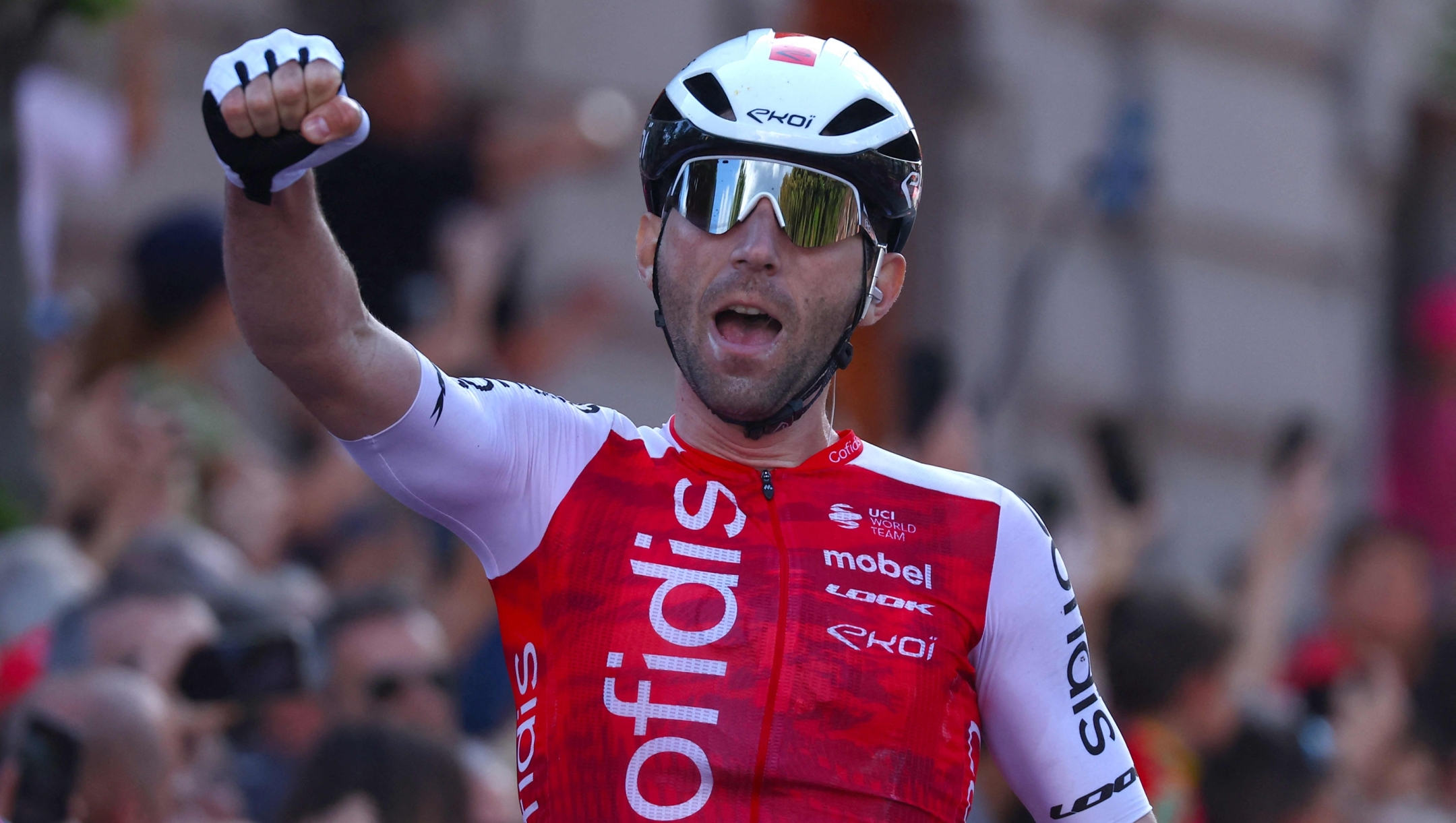 TOPSHOT - Team Cofidis' French rider Benjamin Thomas celebrates as he crosses the finish line to win the 5th stage of the 107th Giro d'Italia cycling race, 178 km between Genova and Lucca, on May 8, 2024 in Lucca. Thomas won ahead of Team EF Education's Danish rider Michael Valgren, second, and Team Polti-Kometa's Italian rider Andrea Pietrobon, third. (Photo by Luca Bettini / AFP)