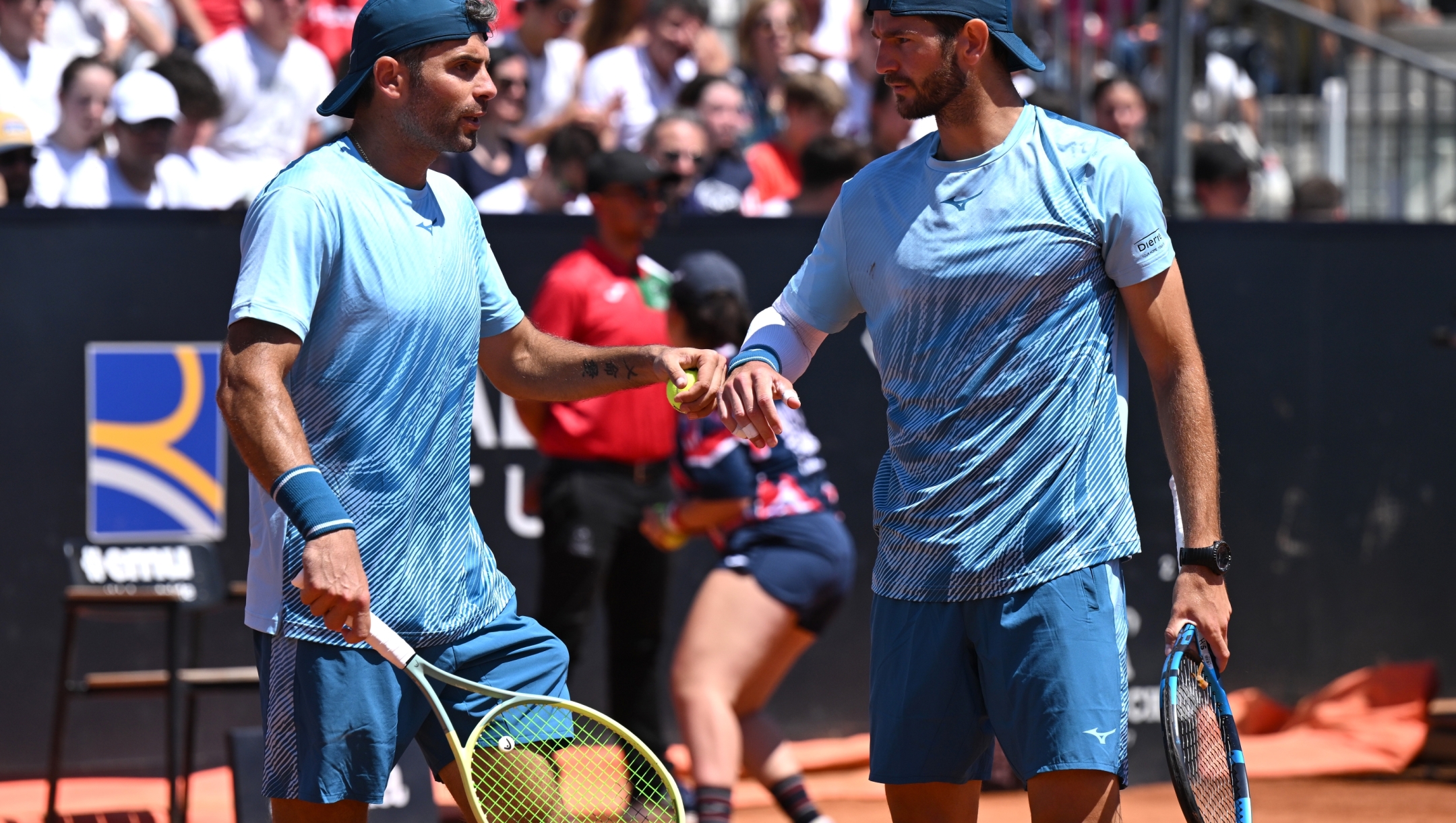 ROME, ITALY - MAY 14: Simone Bolelli and Andrea Vavassori of Italy interact during their Men's Doubles Round of 16 match against Rohan Bopanna of India and Matthew Ebden of Australia on Day Nine of Internazionali BNL D'Italia at Foro Italico on May 14, 2024 in Rome, Italy. (Photo by Mike Hewitt/Getty Images)