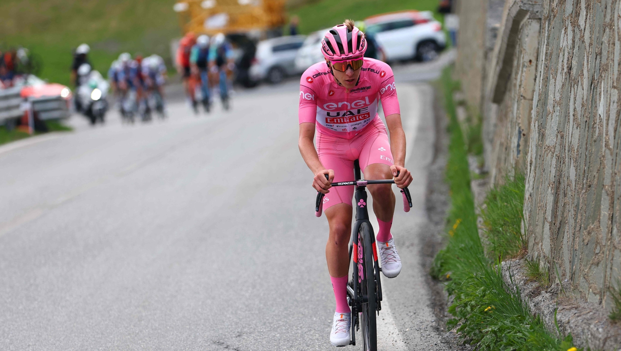 Pink jersey Team UAE's Slovenian rider Tadej Pogacar climbs during the 15th stage of the 107th Giro d'Italia cycling race, 222km between Manerba del Garda and Mottolino on May 19, 2024. (Photo by Luca Bettini / AFP)