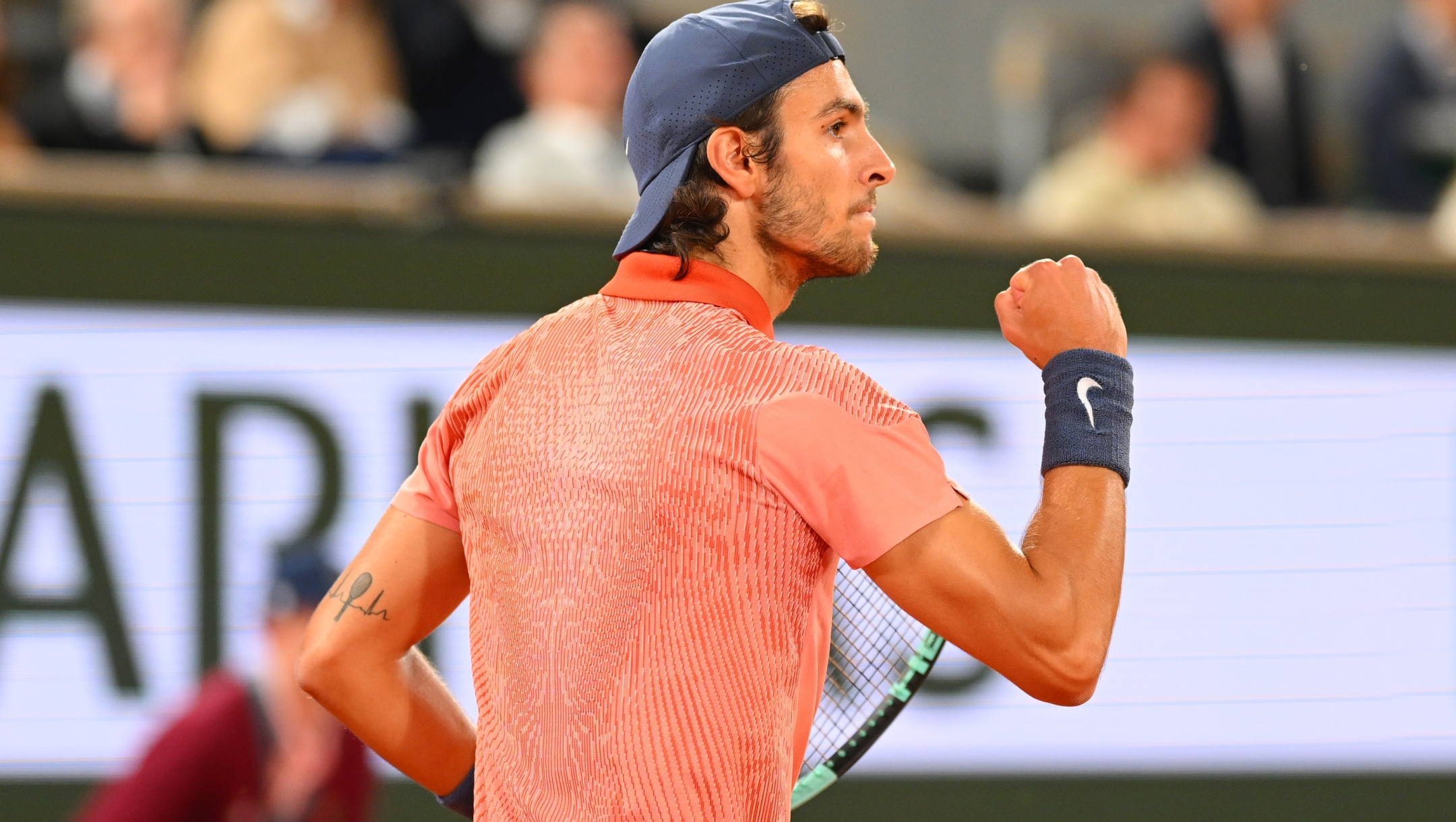 PARIS, FRANCE - MAY 30: Lorenzo Musetti of Italy celebrates a point against Gael Monfils of France in the Men's Singles second round match during Day Five of the 2024 French Open at Roland Garros on May 30, 2024 in Paris, France. (Photo by Clive Mason/Getty Images)