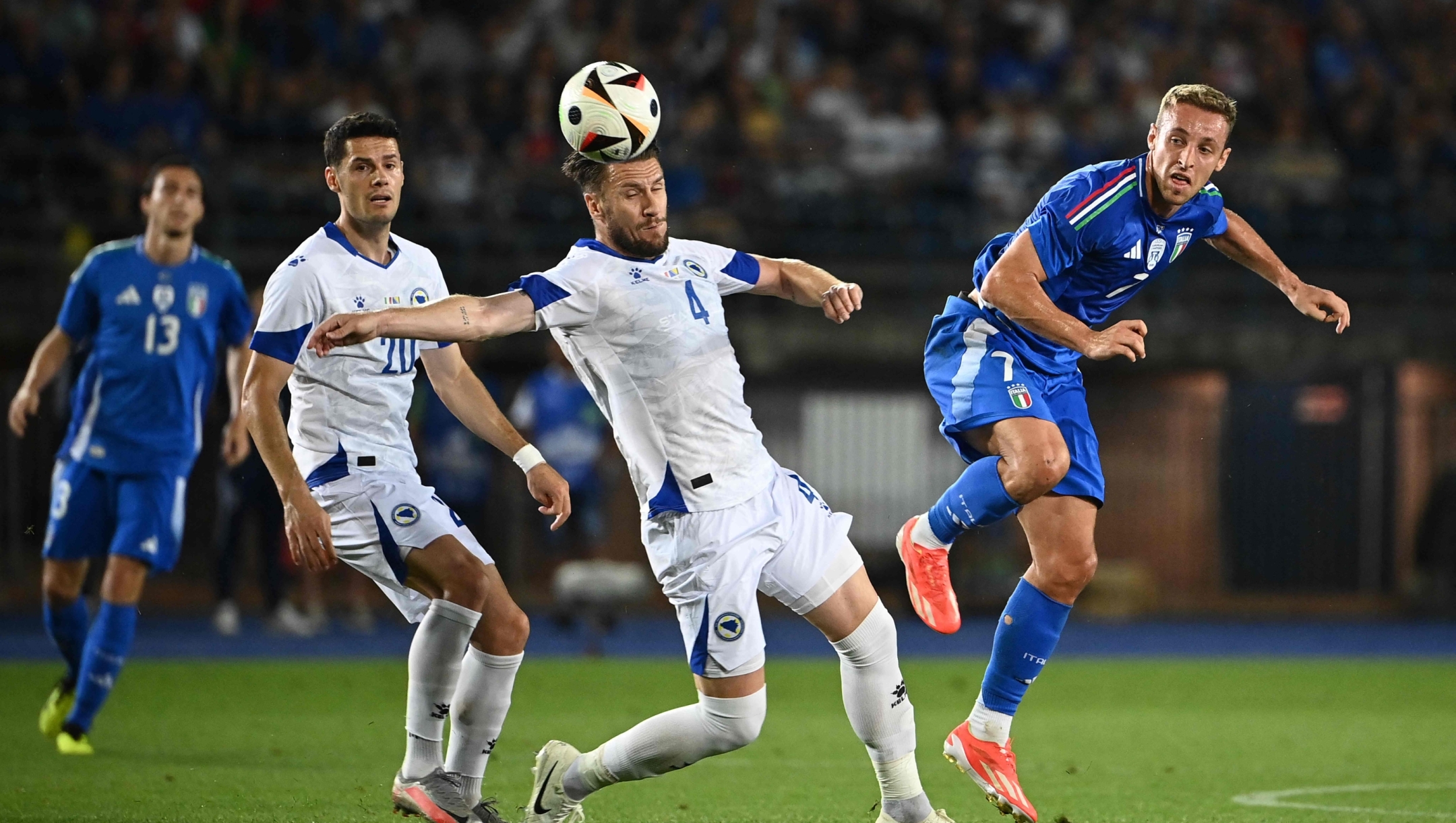 Italy's midfielder #07 Davide Frattesi fights for the ball with Bosnia-Herzegovina's defender #04 Ermin Bicakcic during the International friendly football match between Italy and Bosnia-Herzegovina in Empoli on June 09, 2024. (Photo by Isabella BONOTTO / AFP)