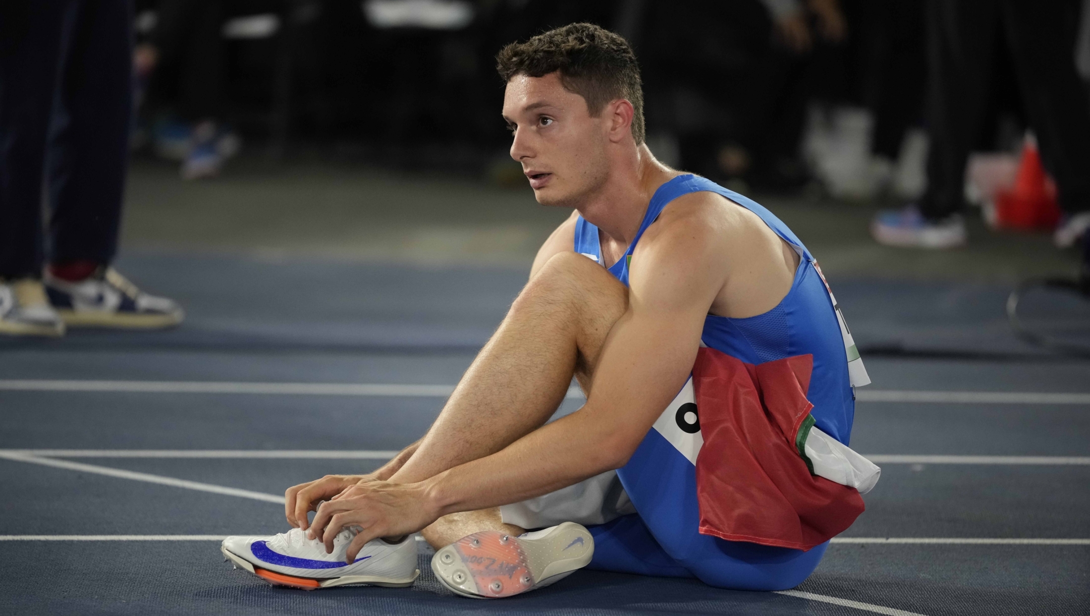 Filippo Tortu, of Italy sits after the the men's 200 meters final at the the European Athletics Championships in Rome, Monday, June 10, 2024. He won the silver medal. (AP Photo/Andrew Medichini)