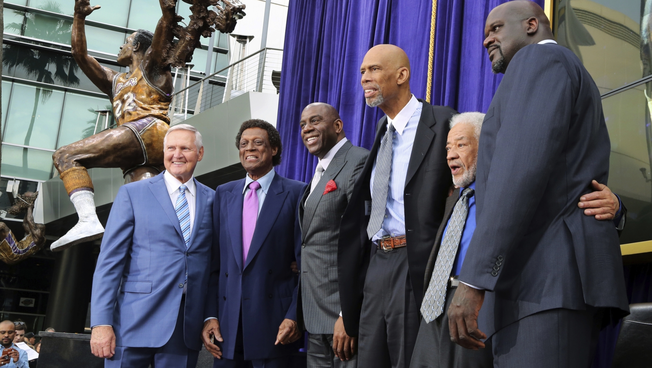 FILE - Lakers greats pose after the unveiling of a statue of Minneapolis and Los Angeles Lakers player Elgin Baylor, second from left, outside Staples Center in Los Angeles Friday, April 6, 2018. From left are Jerry West, Baylor, Earvin "Magic" Johnson, Kareem Abdul-Jabbar, musician Bill Withers, and Shaquille O'Neal. Jerry West, who was selected to the Basketball Hall of Fame three times in a storied career as a player and executive and whose silhouette is considered to be the basis of the NBA logo, died Wednesday morning, the Los Angeles Clippers announced. He was 86.(AP Photo/Reed Saxon, File)
