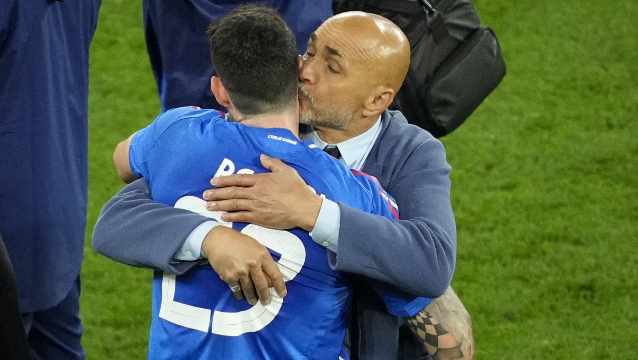 Italy's head coach Luciano Spalletti kisses Alessandro Bastoni at the end of a Group B match between Italy and Albania at the Euro 2024 soccer tournament in Dortmund, Germany, Saturday, June 15, 2024. (AP Photo/Andreea Alexandru)