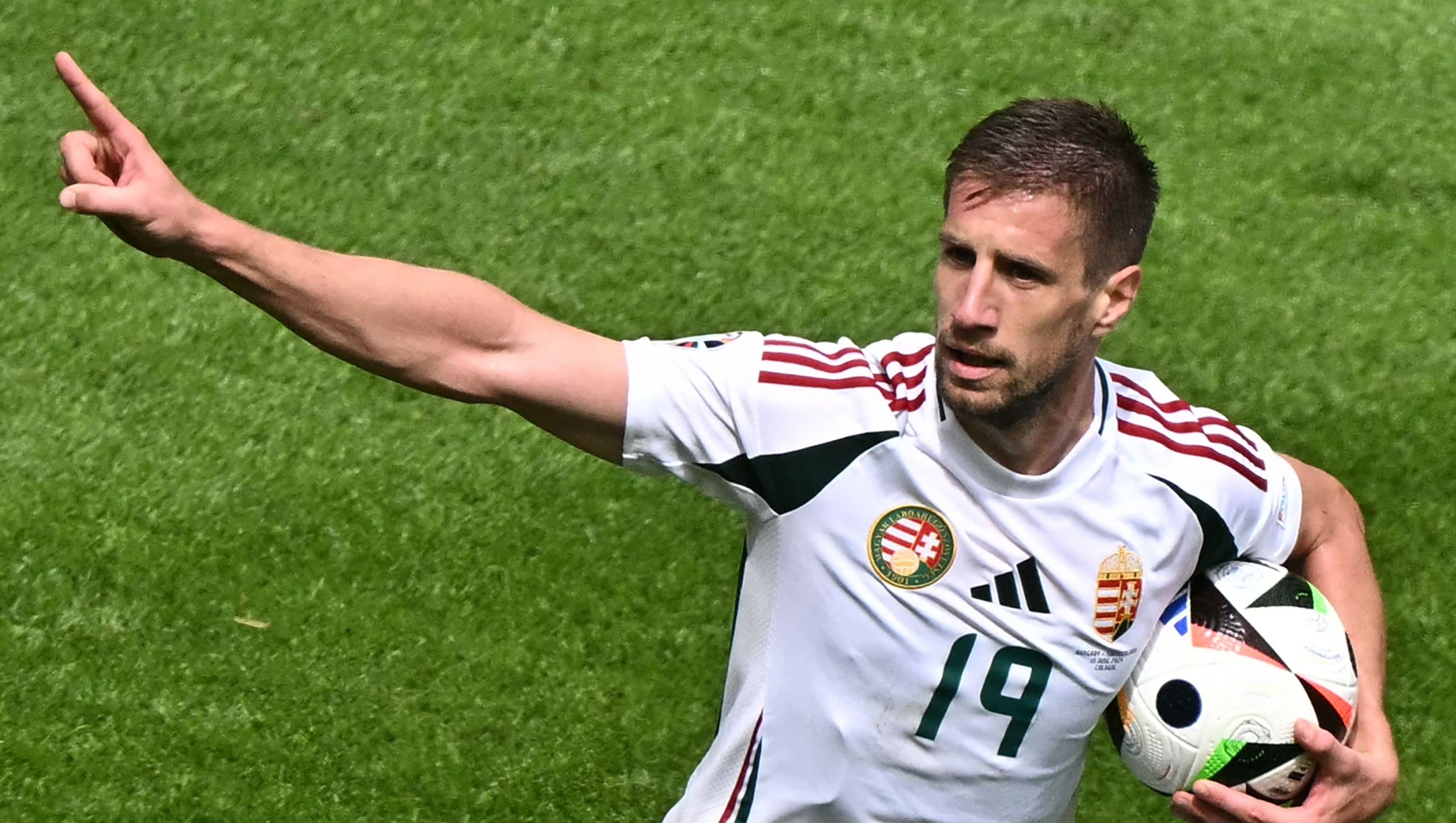 Hungary's forward #19 Barnabas Varga celebrates scoring his team's first goal during the UEFA Euro 2024 Group A football match between Hungary and Switzerland at the Cologne Stadium in Cologne on June 15, 2024. (Photo by JAVIER SORIANO / AFP)